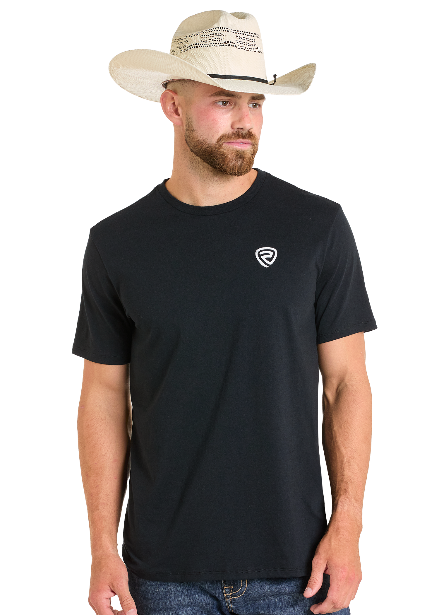 A bearded man in blue jeans and a white cowboy hat wears the Rock & Roll Denim Mexicano Unisex Graphic Tee with a small white chest logo, standing against a plain background—ideal for easygoing everyday wear.