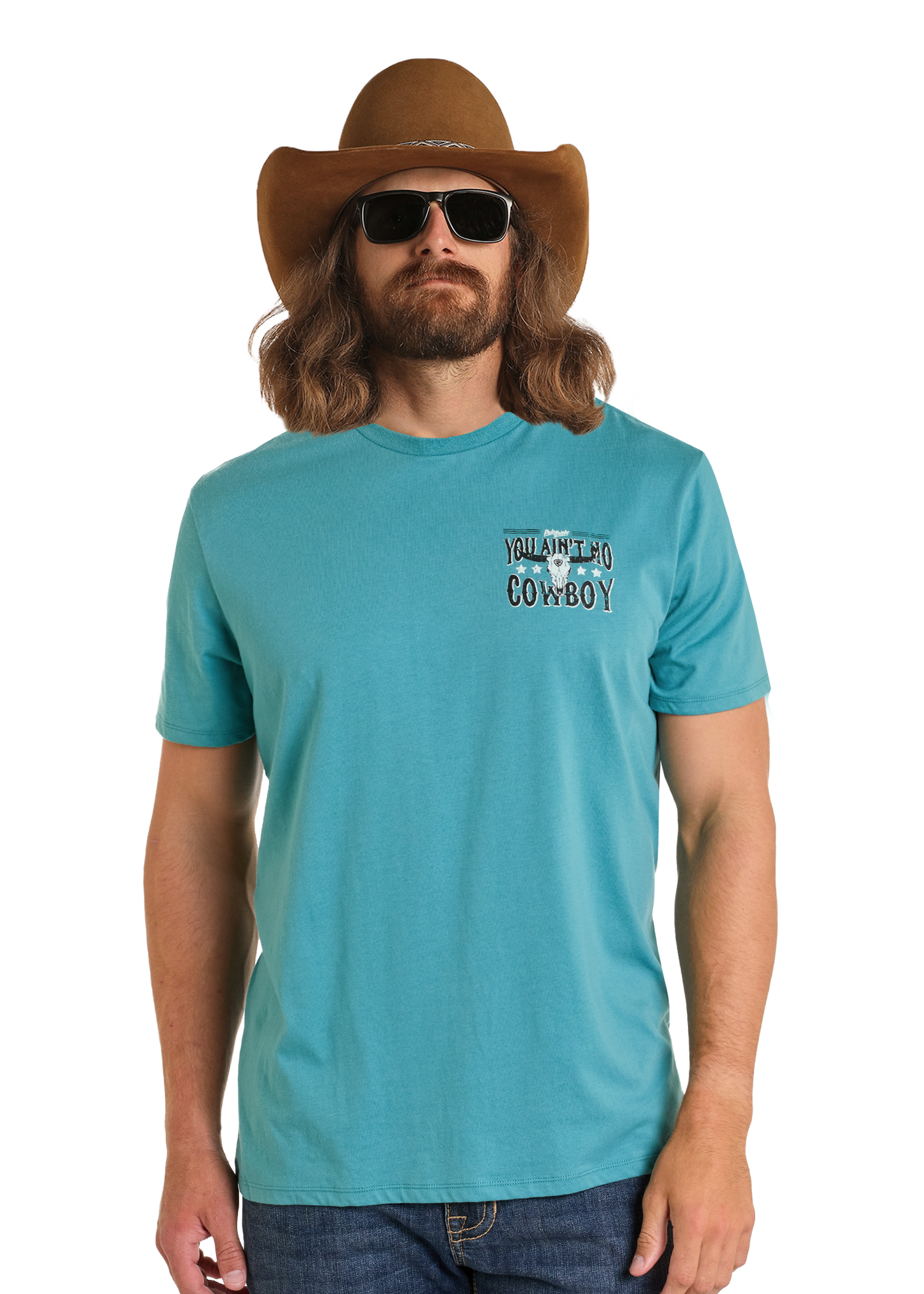 A man with long hair and a beard wears a brown cowboy hat, sunglasses, and a Rock & Roll Denim Dale Brisby You Ain't No Cowboy Graphic Tee against a plain white background.