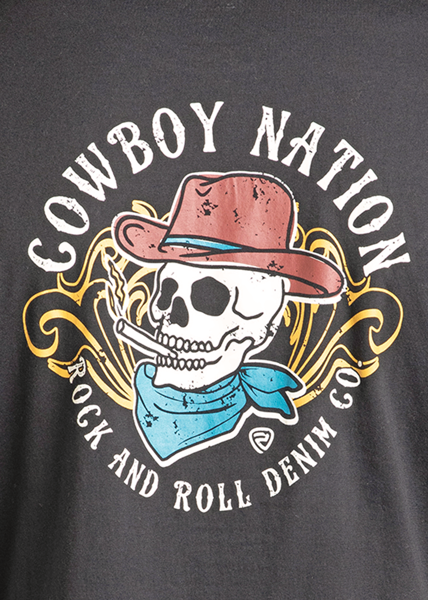 The Cowboy Nation Skull Graphic Tee by Rock & Roll Denim features a skull in a red cowboy hat and blue bandana, smoking, with yellow designs and "Cowboy Nation Rock & Roll Denim Co." text—a standout tee for any collection.