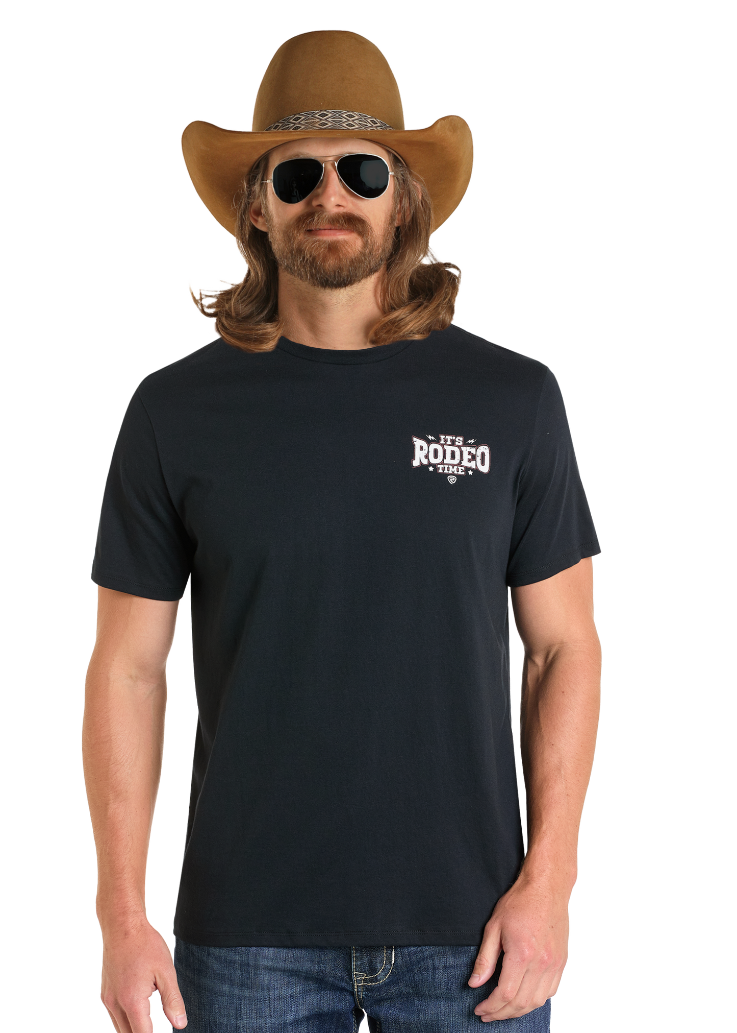 A long-haired, bearded man wears a brown cowboy hat, black sunglasses, blue jeans, and the Rock & Roll Denim Dale Brisby It's Rodeo Time Graphic Tee with "It's Rodeo Time" on the chest, standing against a plain white background.