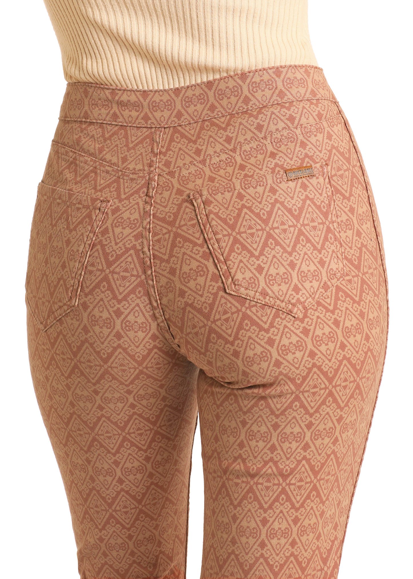 A close-up of a woman wearing Rock & Roll Denim’s Reversible Aztec Modest Bootcut Jeans.