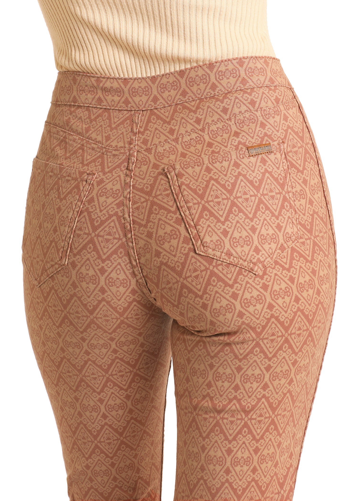 A close-up of a woman wearing Rock & Roll Denim’s Reversible Aztec Modest Bootcut Jeans.