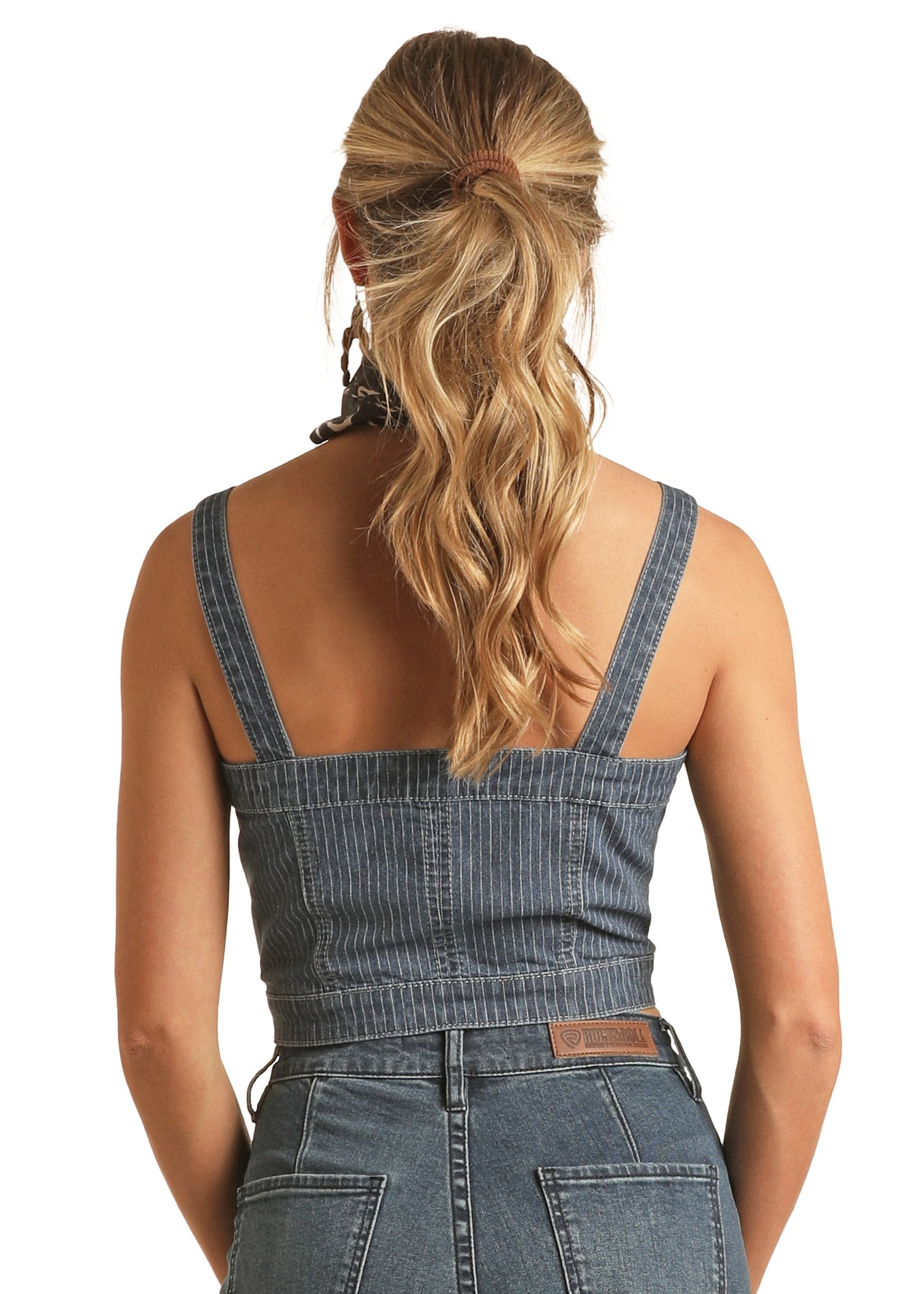 Person wearing a denim overalls on a white background