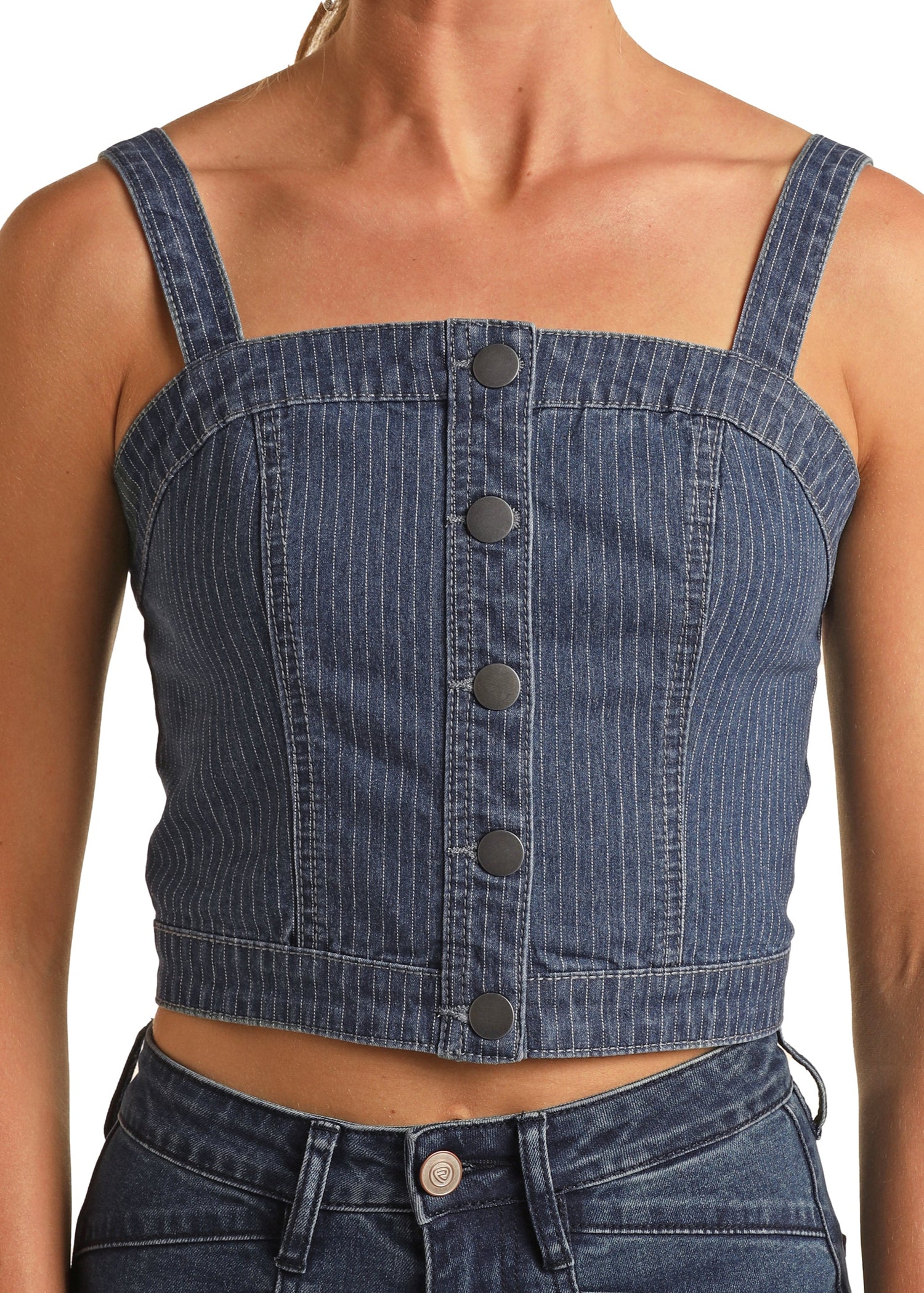 Denim crop top with button details on a white background