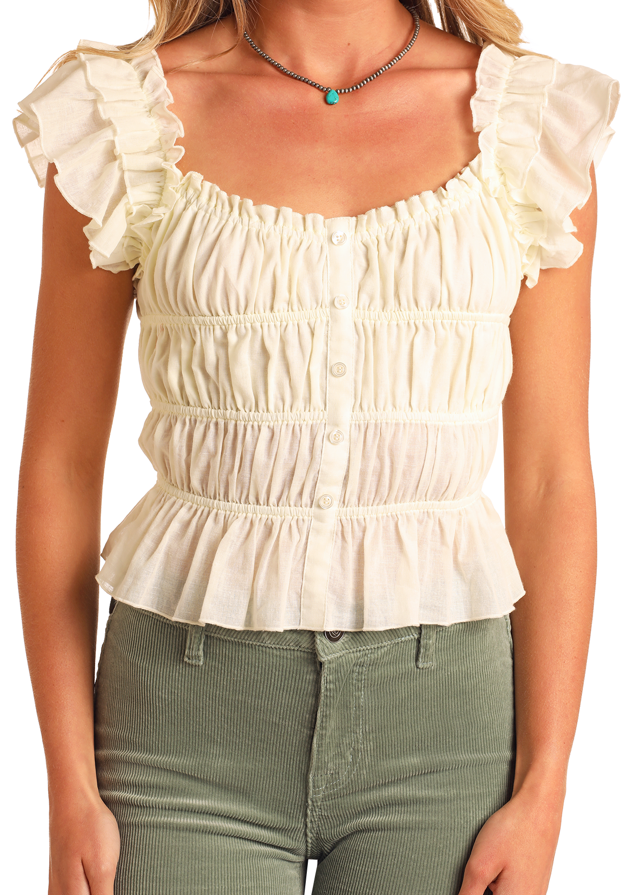 A woman wears a cream Ruched Peplum Top by Rock & Roll Denim with short sleeves, button-up front, and ruched bodice, paired with high-waisted light green corduroy pants. Her face is not shown.