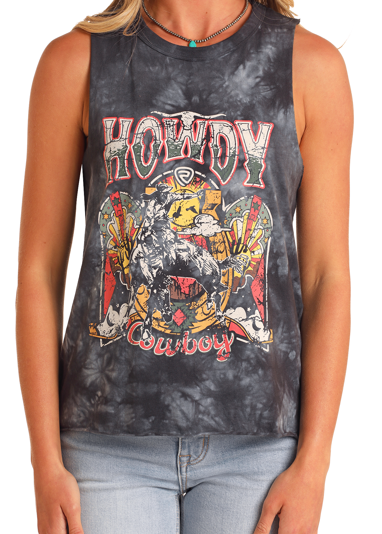 Wearing a Rock & Roll Denim Howdy Cowboy Graphic Tank - M, a sleeveless tie-dye top with a cowboy and vintage lettering, they pair it with a turquoise bead necklace and light jeans.
