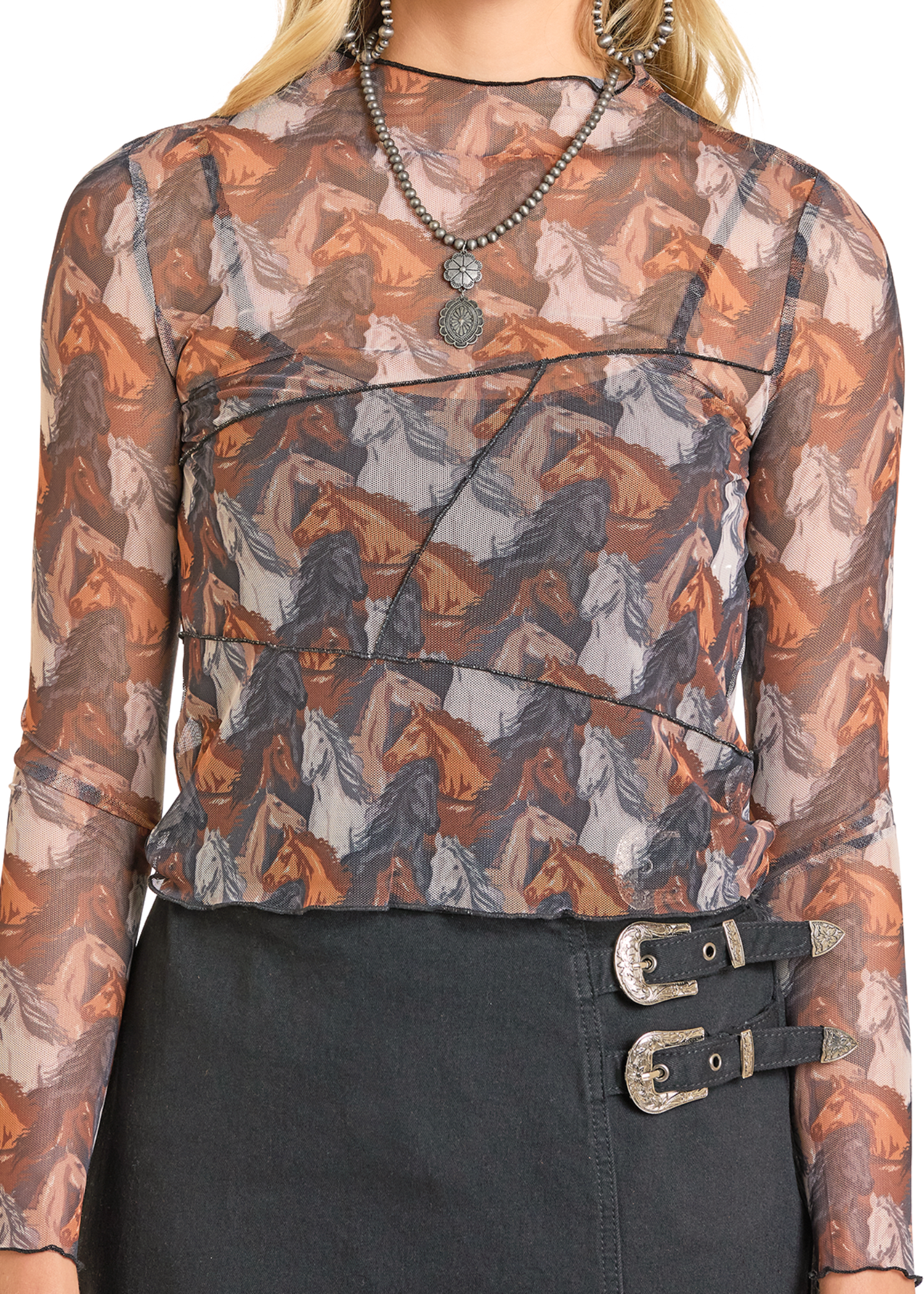 Top with horse pattern and black skirt with buckles on a white background