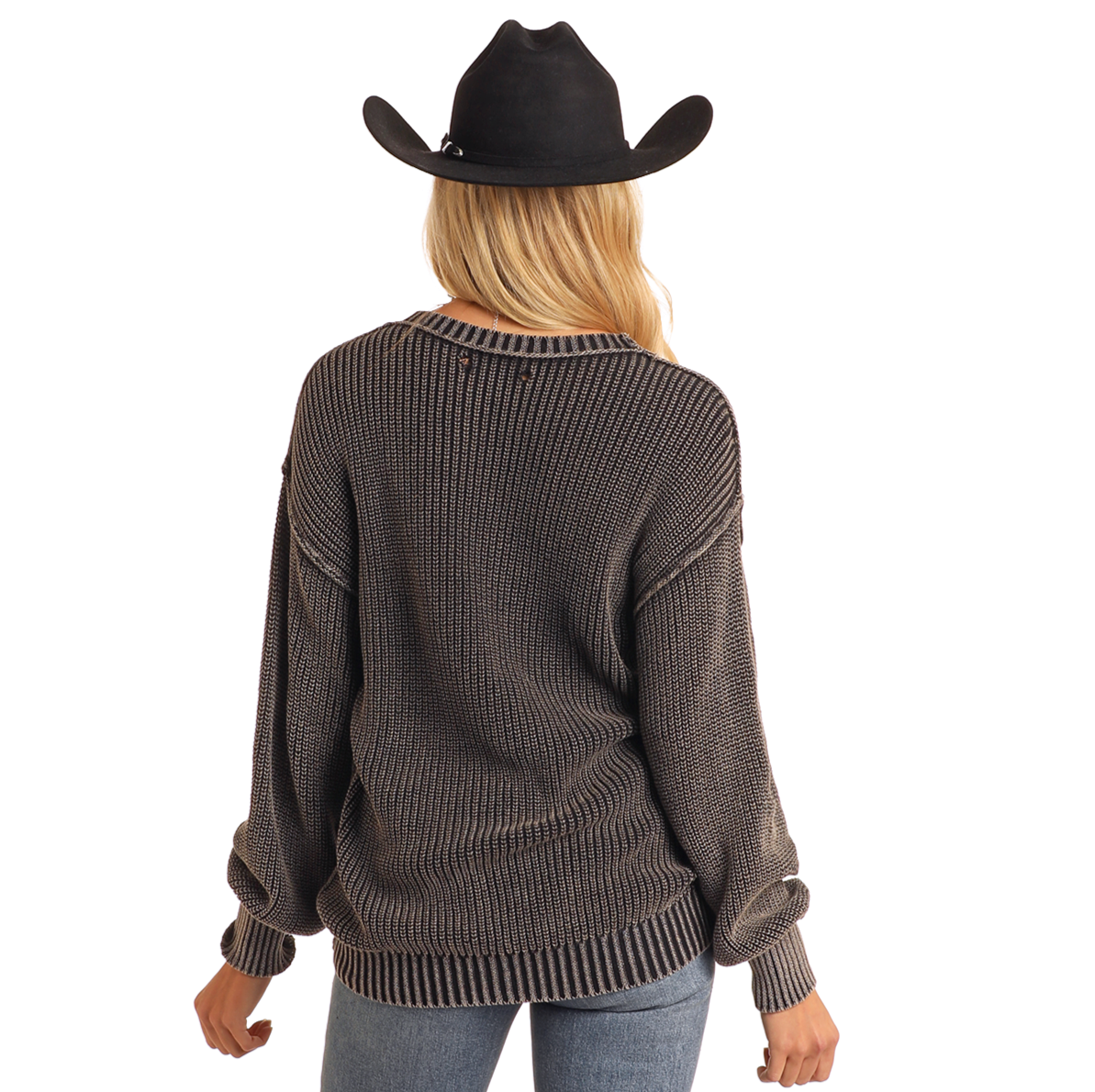 A person in a Rock & Roll Denim Reversible Rib Knit Sweater (size S), black wide-brimmed hat, and light blue jeans stands facing away against a plain white background.