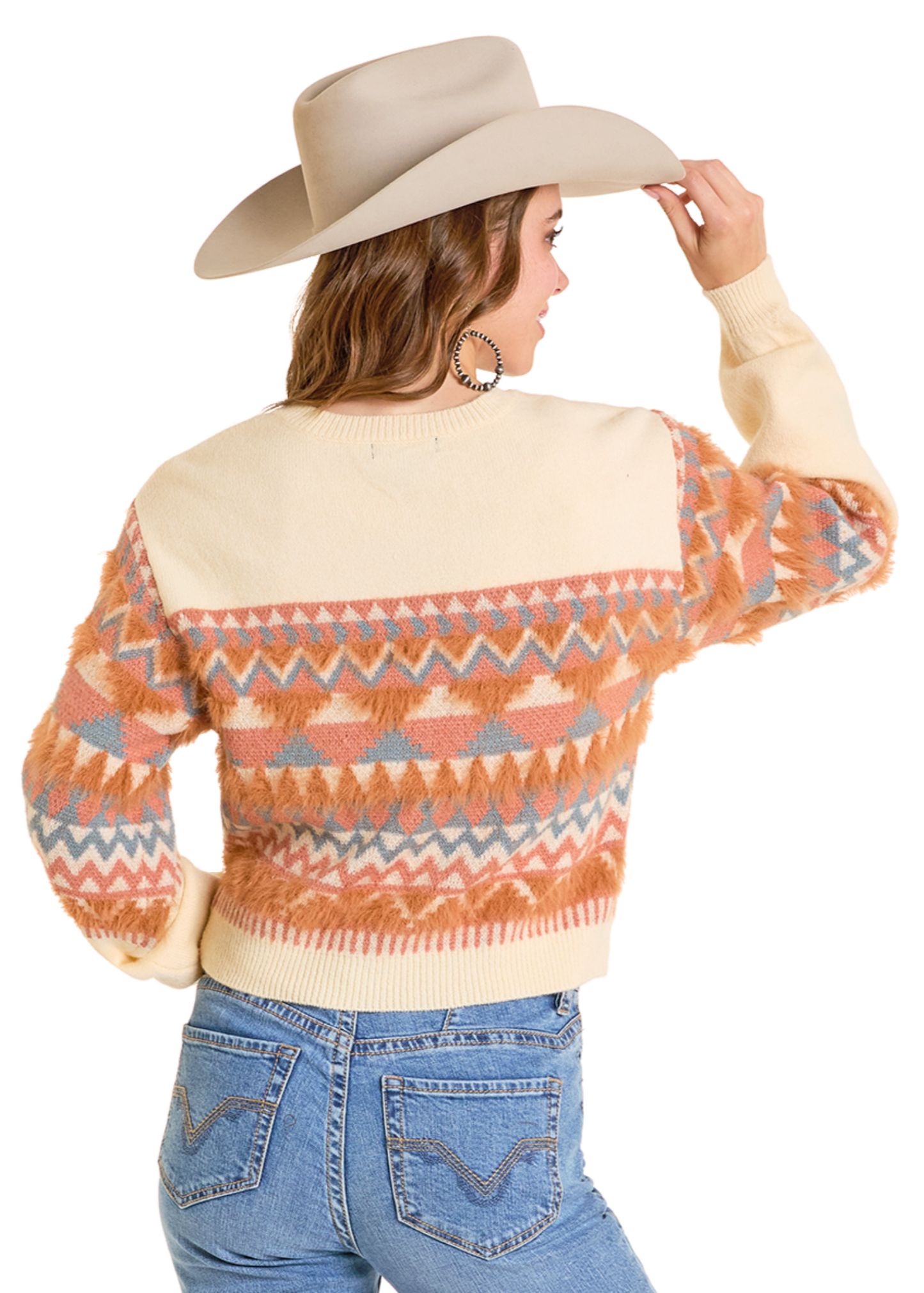 Person wearing a patterned sweater, jeans, and cowboy hat on a white background