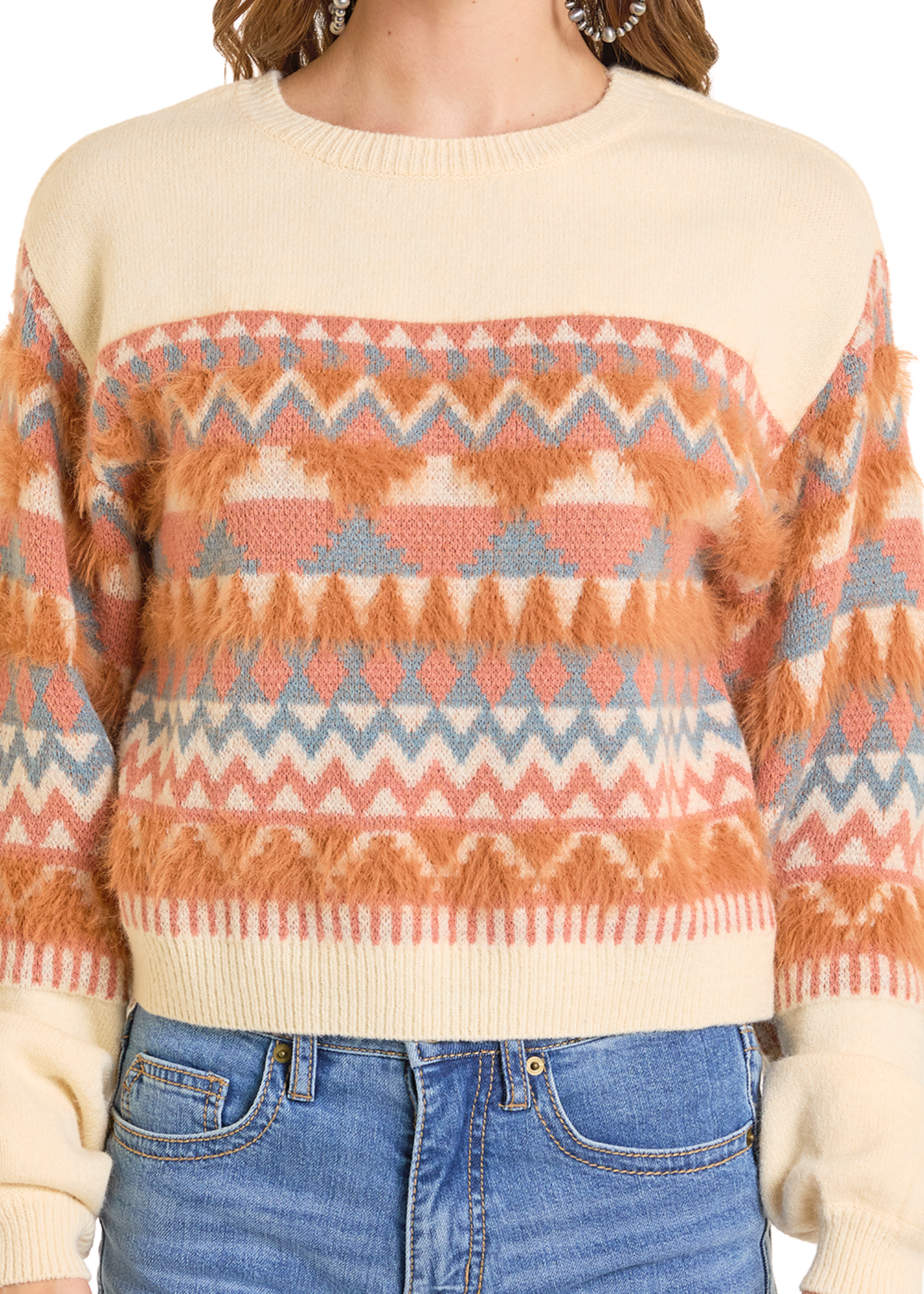 Person wearing a patterned sweater with a neutral background