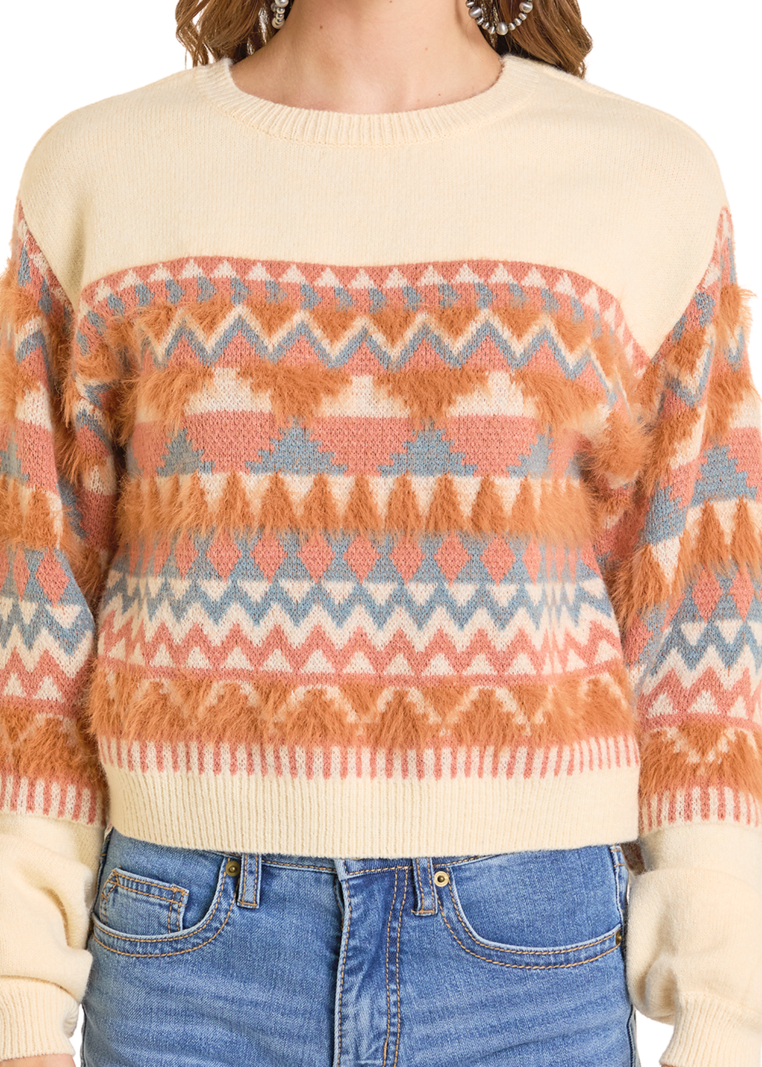 Person wearing a patterned sweater with a neutral background