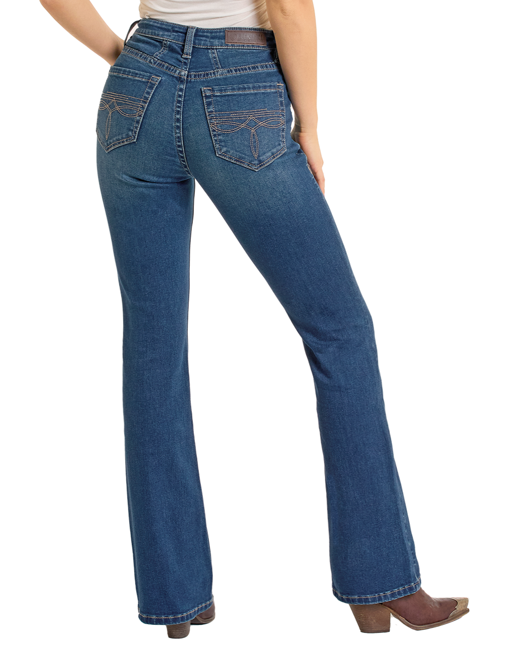 A person shown from the back wears Rock & Roll Denim High Rise Two Tone Bootcut Jeans with decorative back pocket stitching and brown heeled boots, standing against a plain white background.