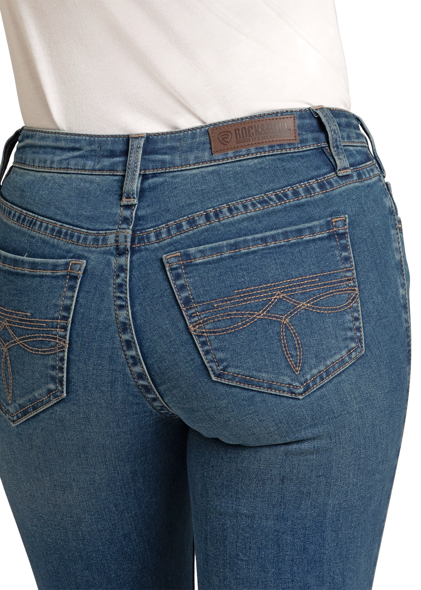 A person wearing Rock & Roll Denim Mid Rise Boot Stitch Bootcut Jeans and a white top, shown from the waist down and viewed from the back.