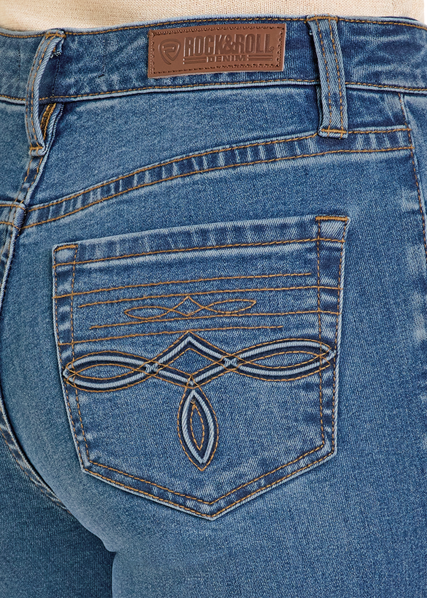 Close-up of blue jeans with a brand logo on the pocket and back waistband.