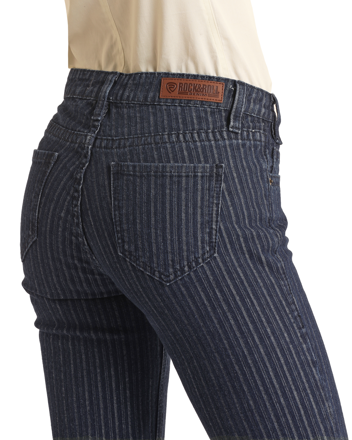A person wears Jacquard Mid Rise Trouser Jeans by Rock & Roll Denim, featuring blue pinstripes, a visible back pocket, and a brown leather brand patch, styled with a tucked-in white top for western sophistication.