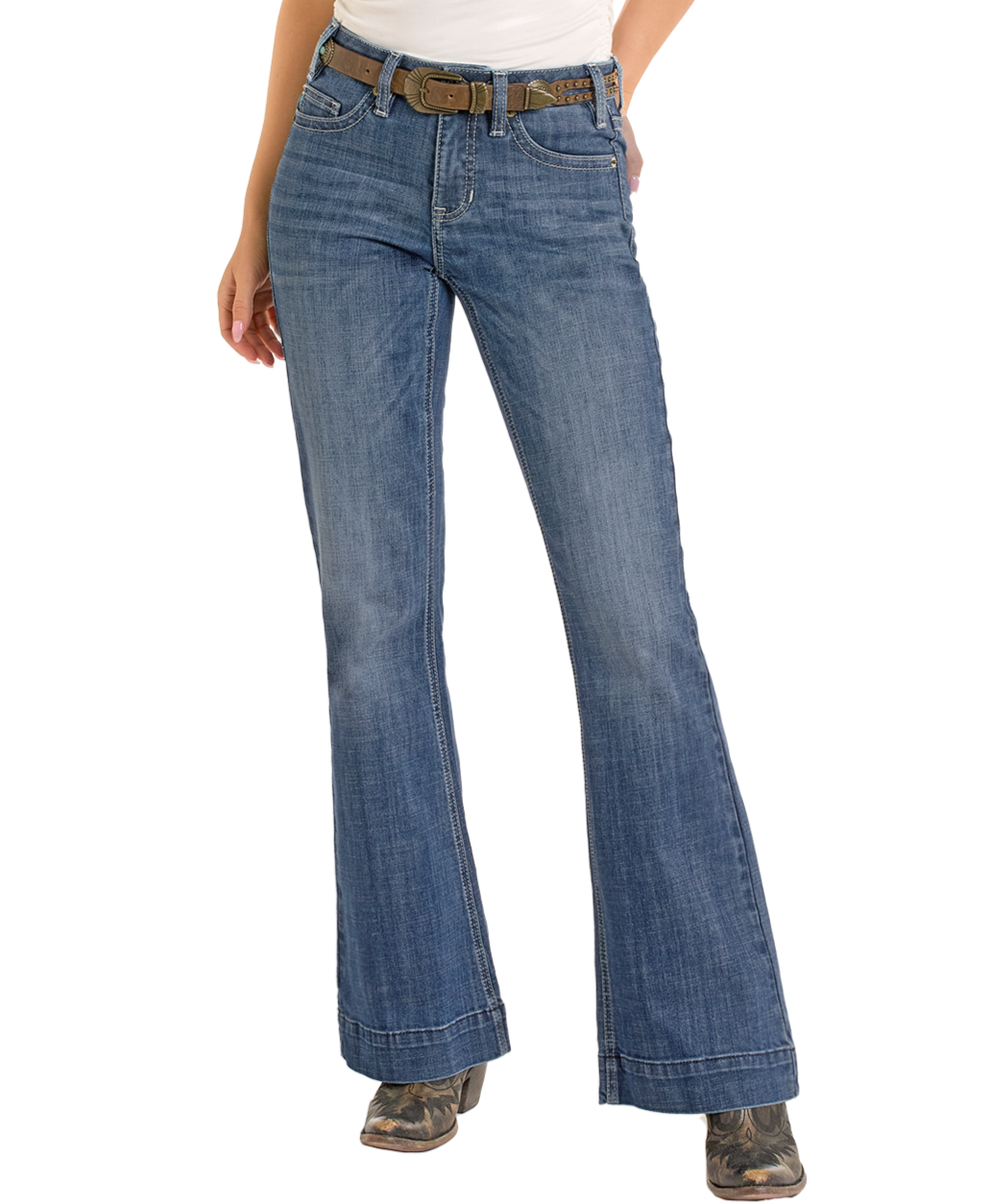 A person is shown from the waist down wearing Rock & Roll Denim Mid Rise Pleather Embroidered Trousers, paired with a brown belt and cowboy boots, standing against a plain white background.