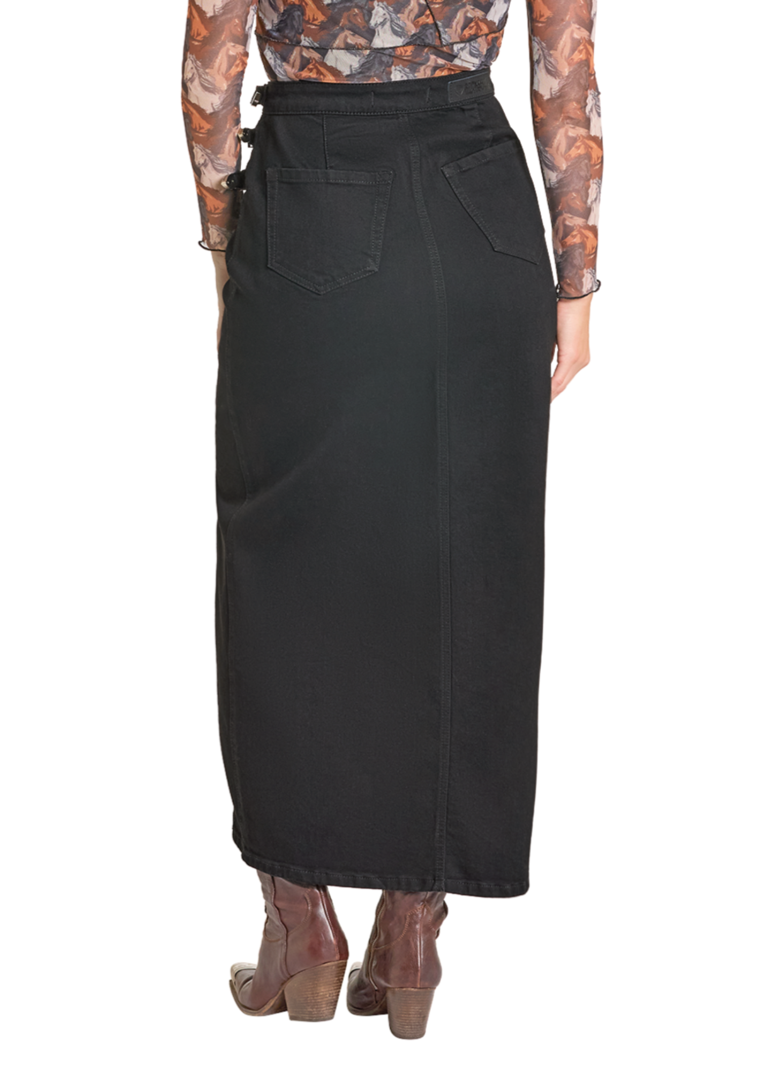 A person is shown from the back wearing the Rock & Roll Denim Buckle Denim Maxi Skirt with triple buckles, brown ankle boots, and a sheer long-sleeve top, all set against a white background.