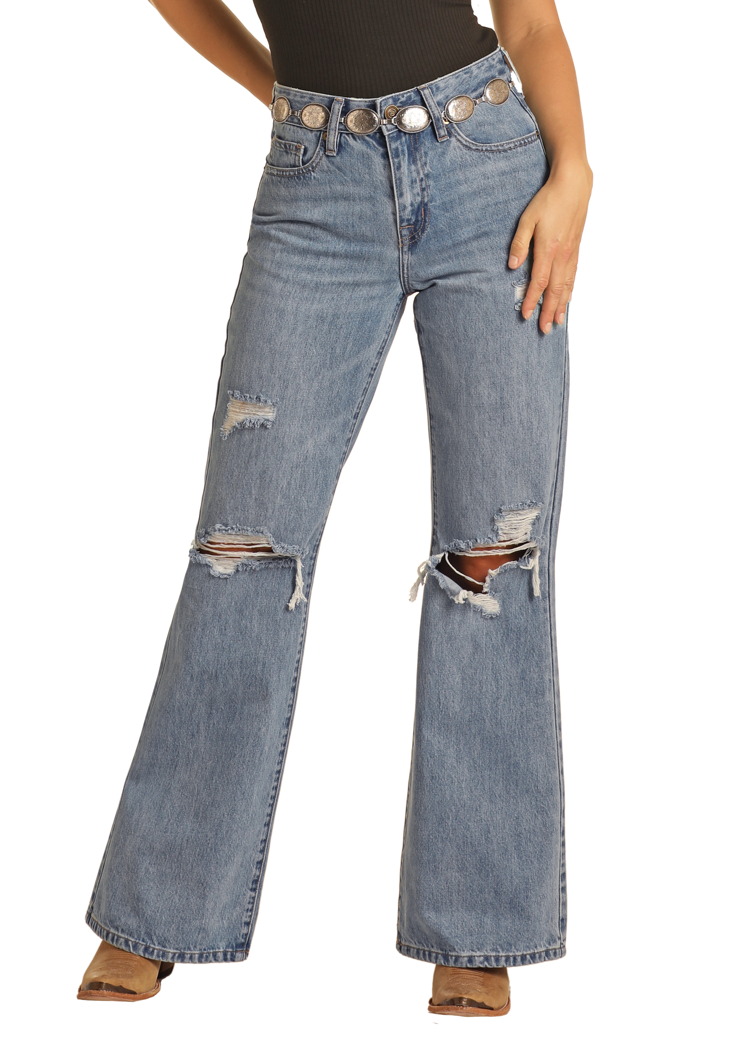 Woman wearing a black tank top and blue jeans with a cowboy hat on a white background