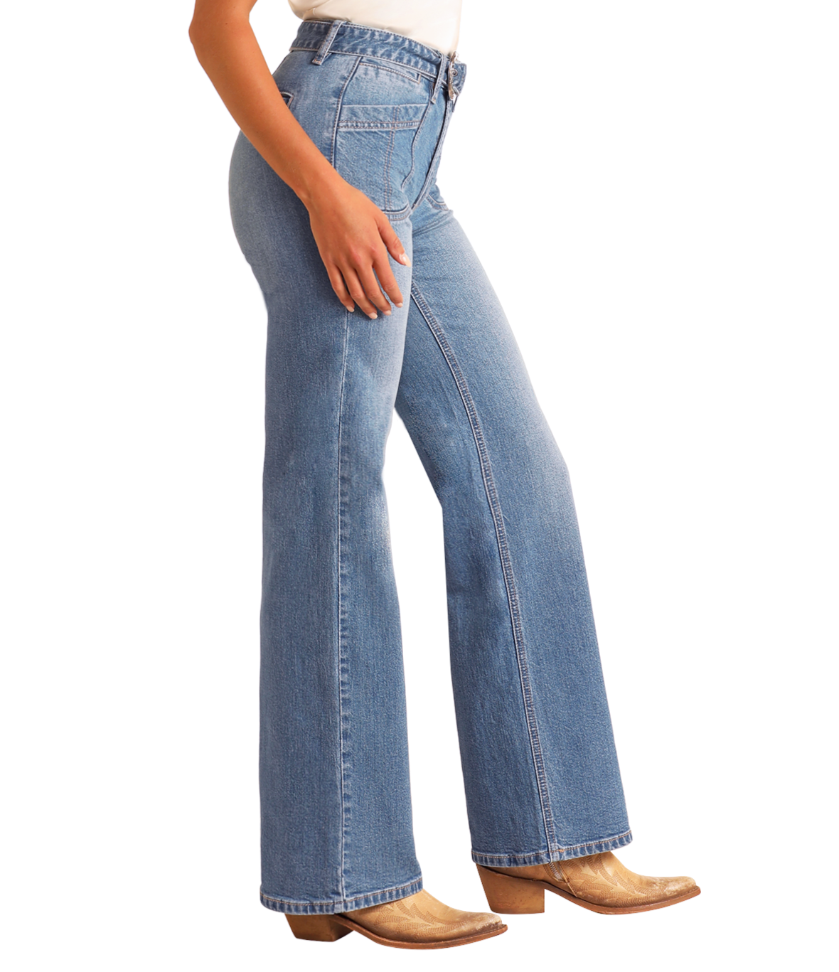 Someone wearing Rock & Roll Denim High Rise Belted Relaxed Flare Jeans in light blue and tan cowboy boots stands sideways with one hand on their thigh.