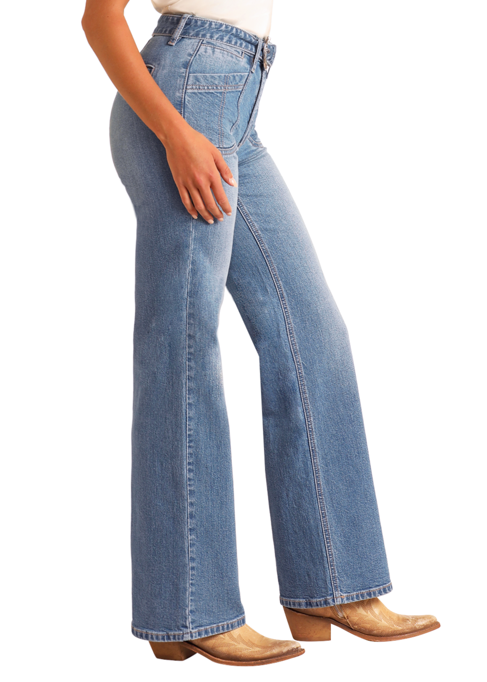 Someone wearing Rock & Roll Denim High Rise Belted Relaxed Flare Jeans in light blue and tan cowboy boots stands sideways with one hand on their thigh.