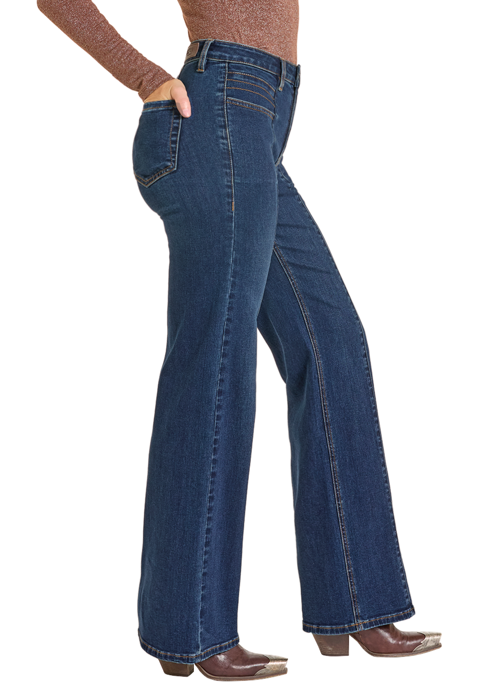 A person wears Rock & Roll Denim High Rise Front Pocket Flare Jeans with a brown long-sleeve top, stands sideways with one hand in their pocket, and completes the look with brown heeled boots.