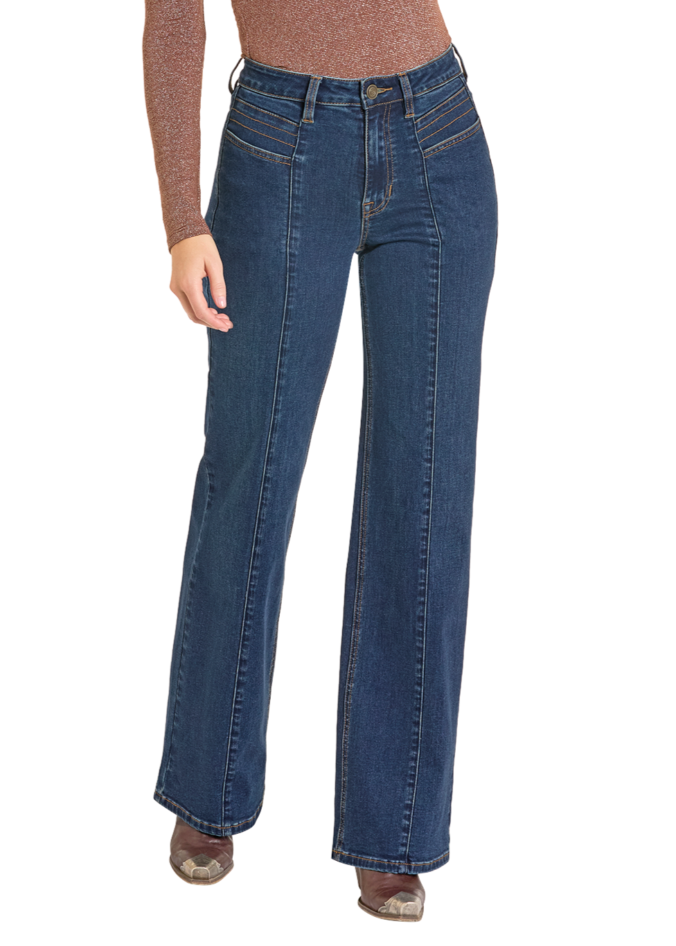 A person wears Rock & Roll Denim High Rise Front Pocket Flare Jeans in dark blue with front seams, a shimmery brown long-sleeve top, and brown shoes, standing against a plain white background.