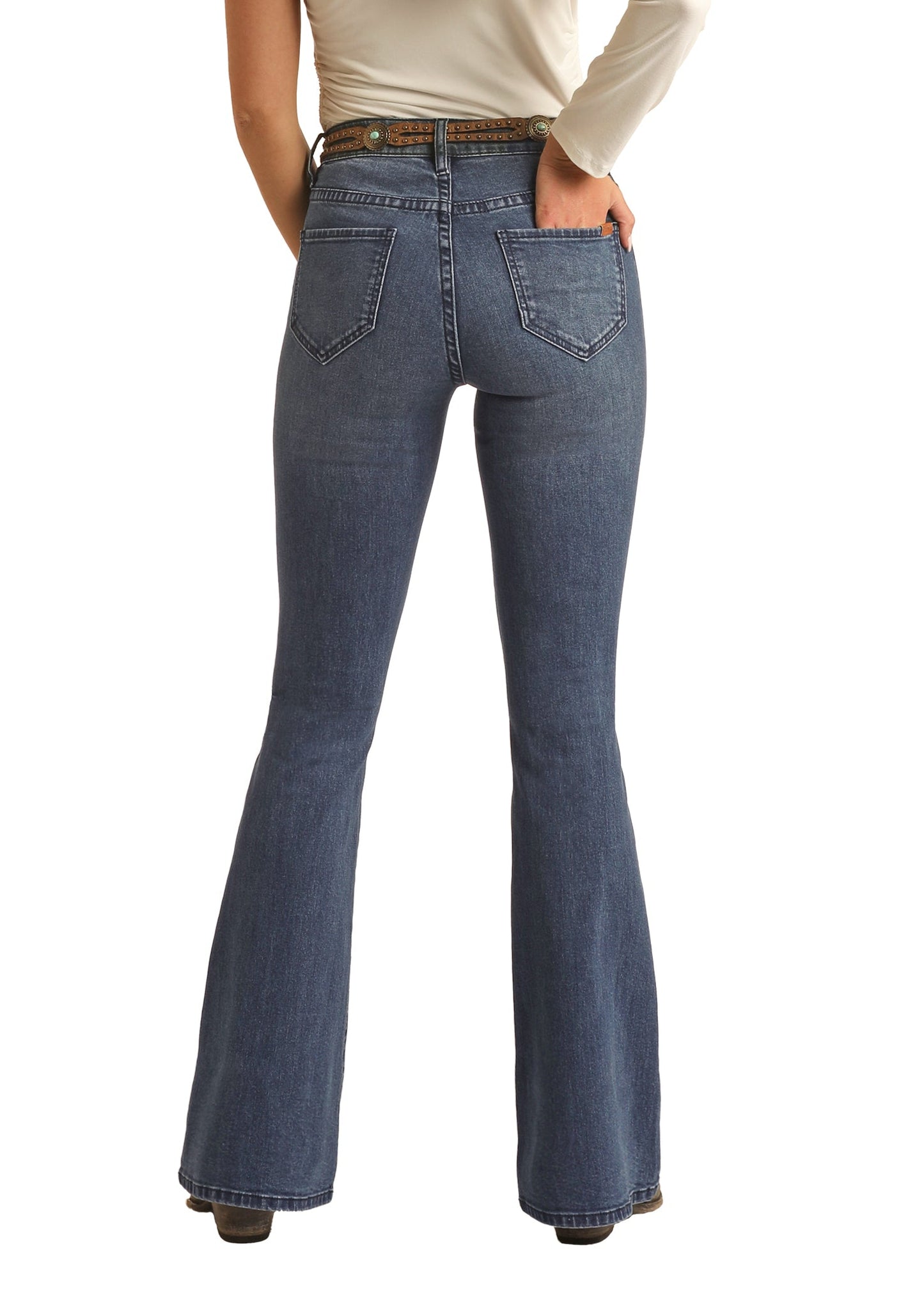 Person wearing a cowboy hat and blue jeans on a white background