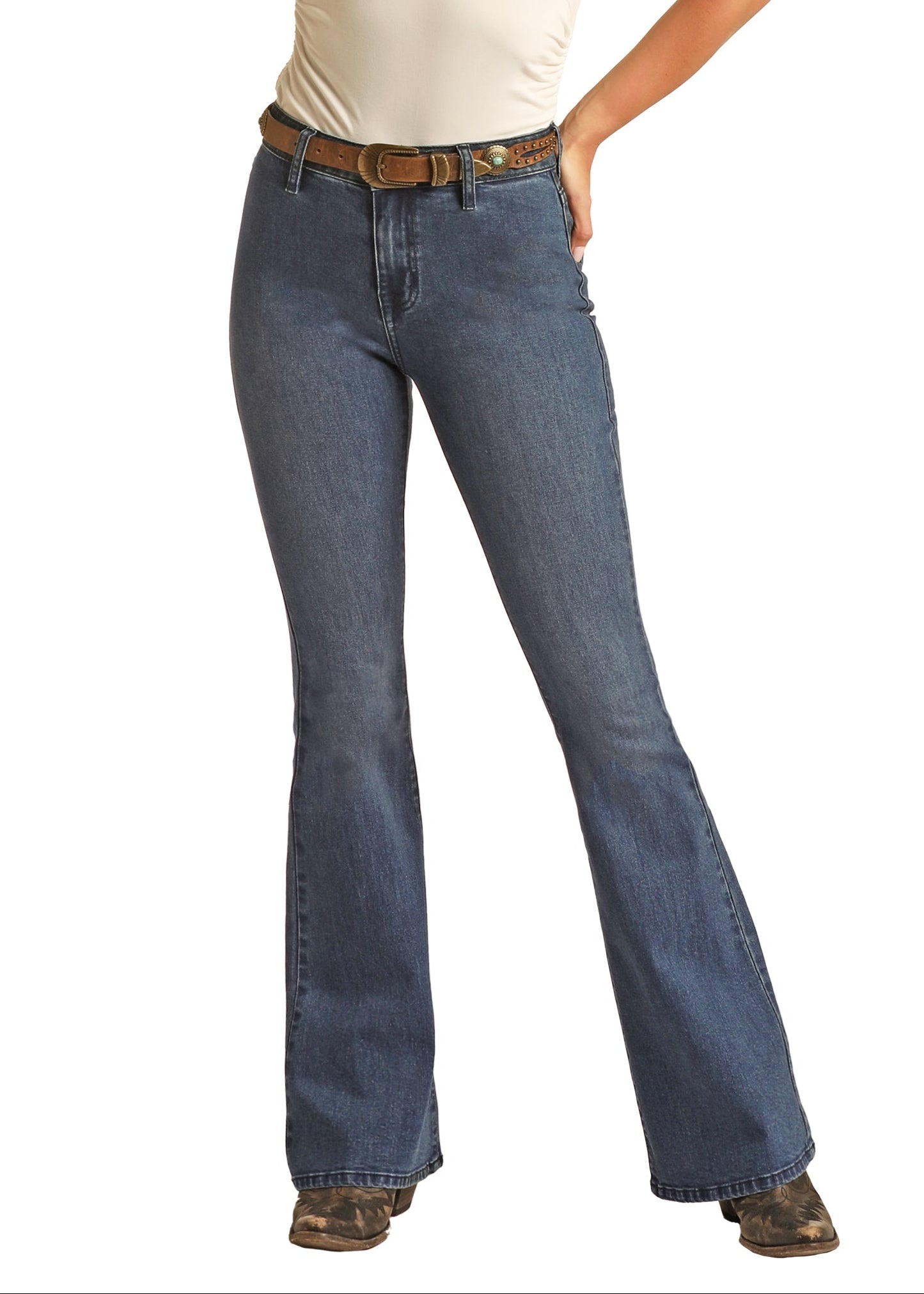 Woman wearing a white top, blue jeans, and a cowboy hat on a white background