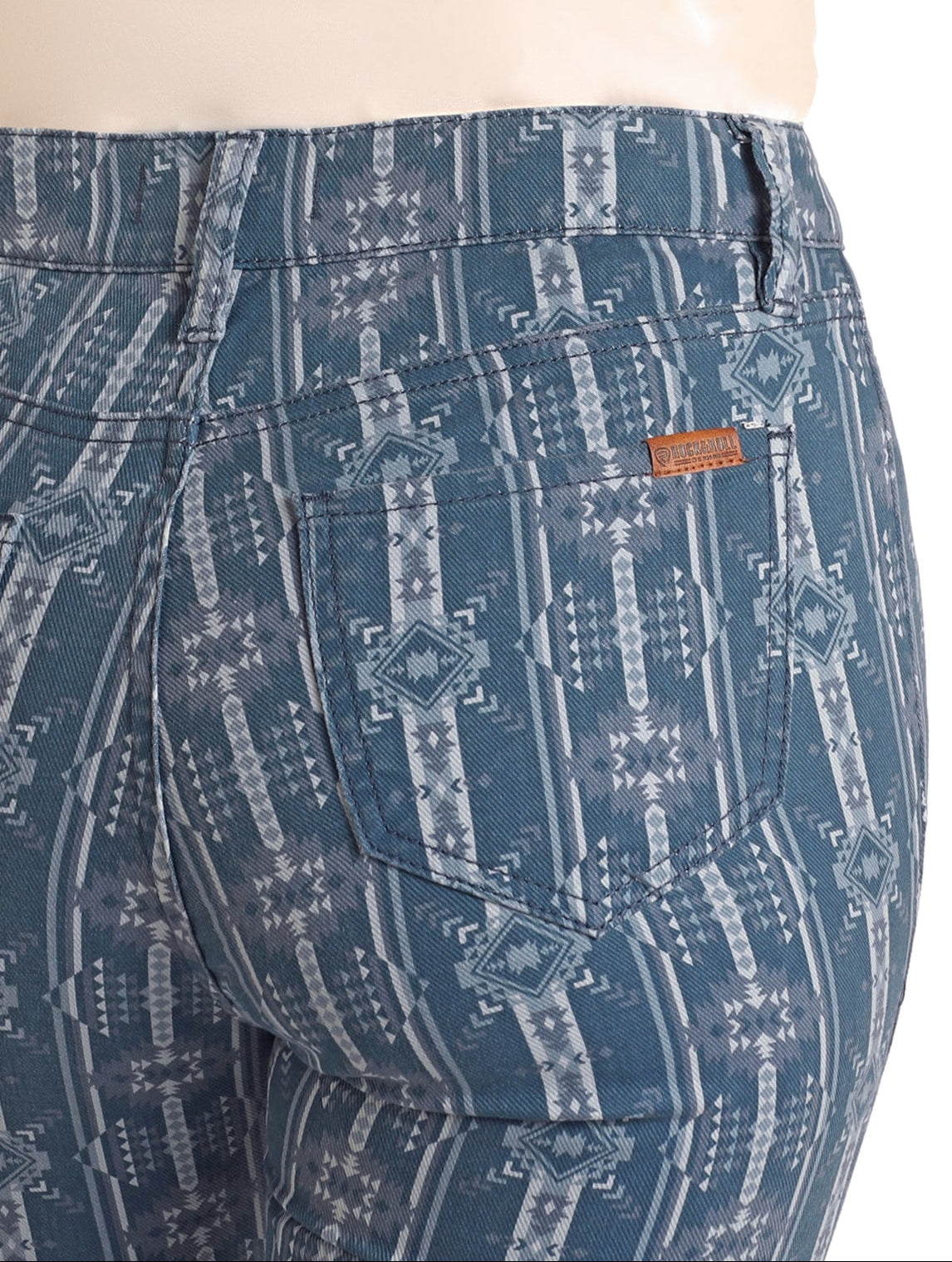 Blue patterned pants on a mannequin with a white background