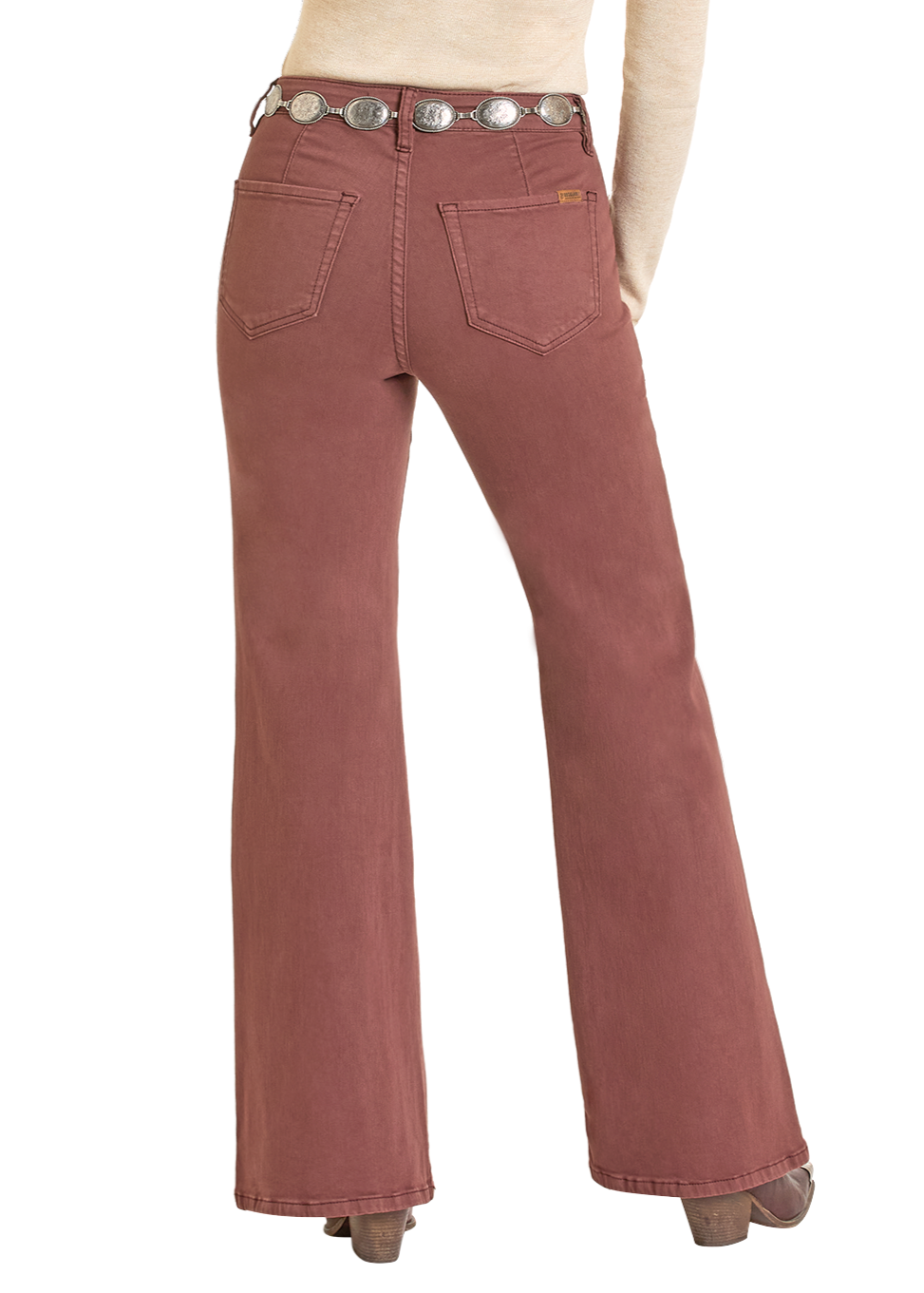Model wears Rock & Roll Denim High Rise Wine Button Flare Jeans with back pockets, a cream top, silver concho belt, and brown platform shoes, shown from the back against a white background.
