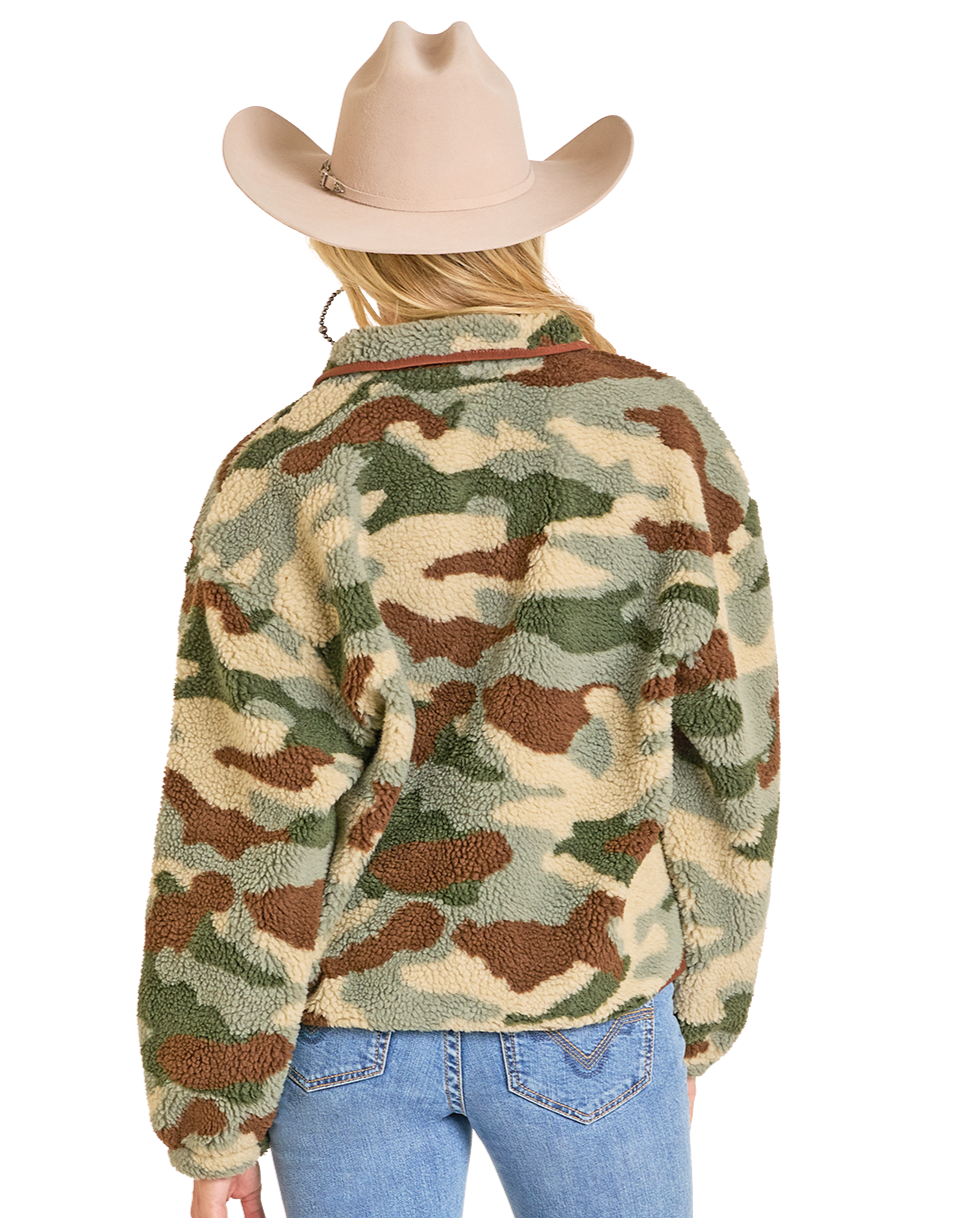 A person is shown from the back wearing light blue jeans, a tan cowboy hat, and a Rock & Roll Denim Camo Print Sherpa Pullover, featuring a green and brown camouflage pattern with a quarter zip, against a plain white background.