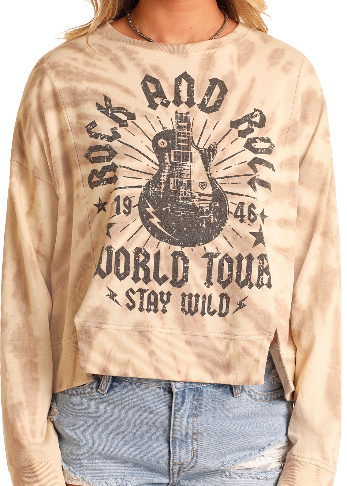 A person wears the Rock & Roll Denim Tie-Dye Graphic Pullover featuring a black electric guitar and "Rock and Roll World Tour 1946 Stay Wild," paired with distressed denim shorts.