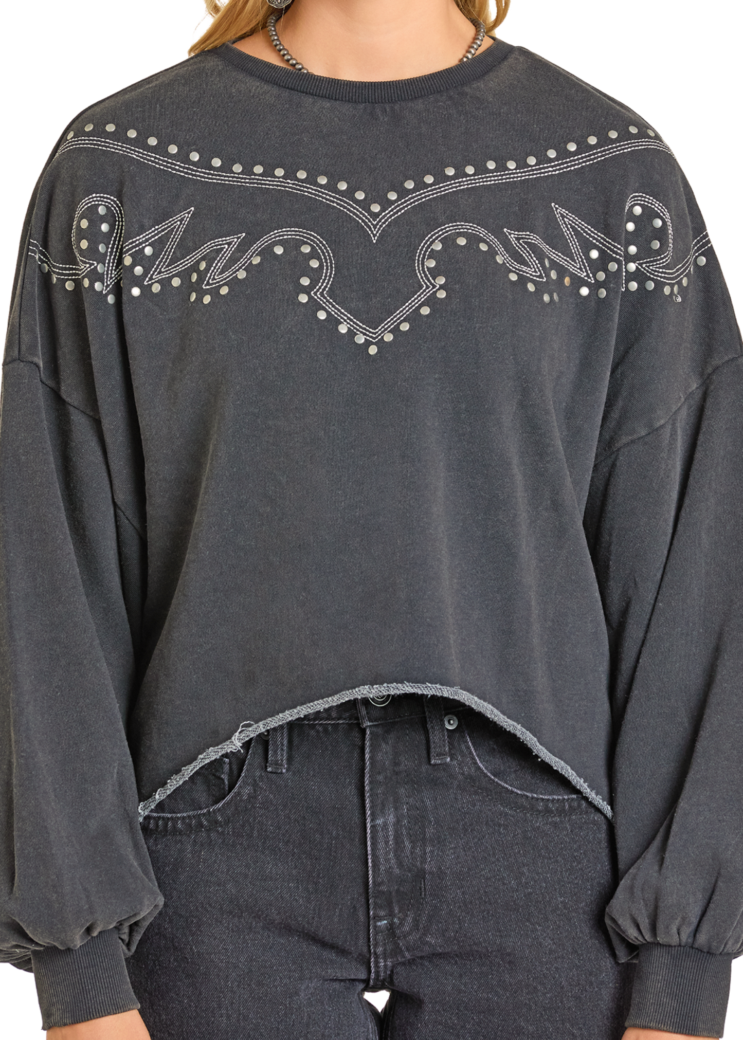 Dark gray sweatshirt with decorative patterns on a plain background