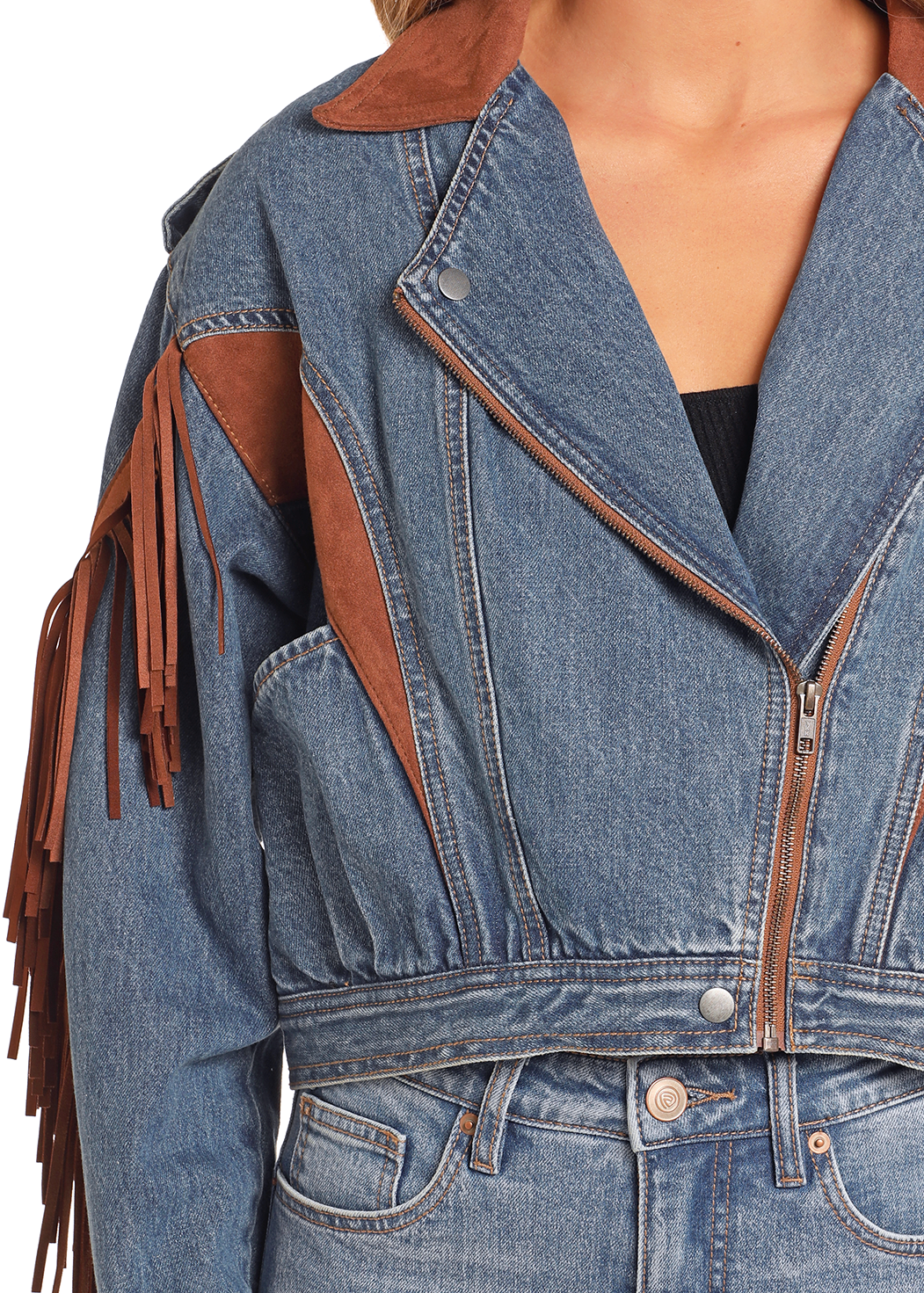 Denim jacket with brown leather accents and fringes on a white background
