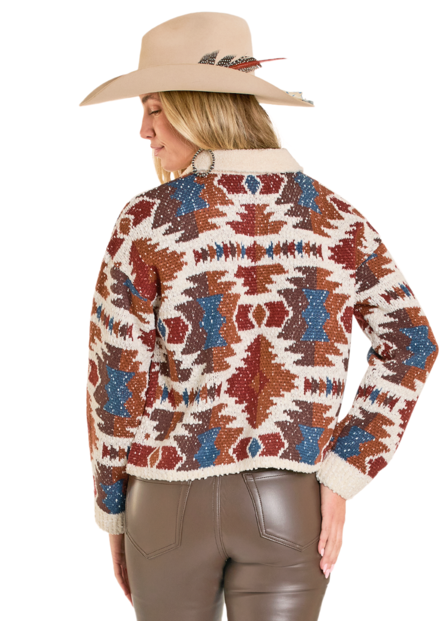 Person wearing a patterned sweater and cowboy hat on a white background