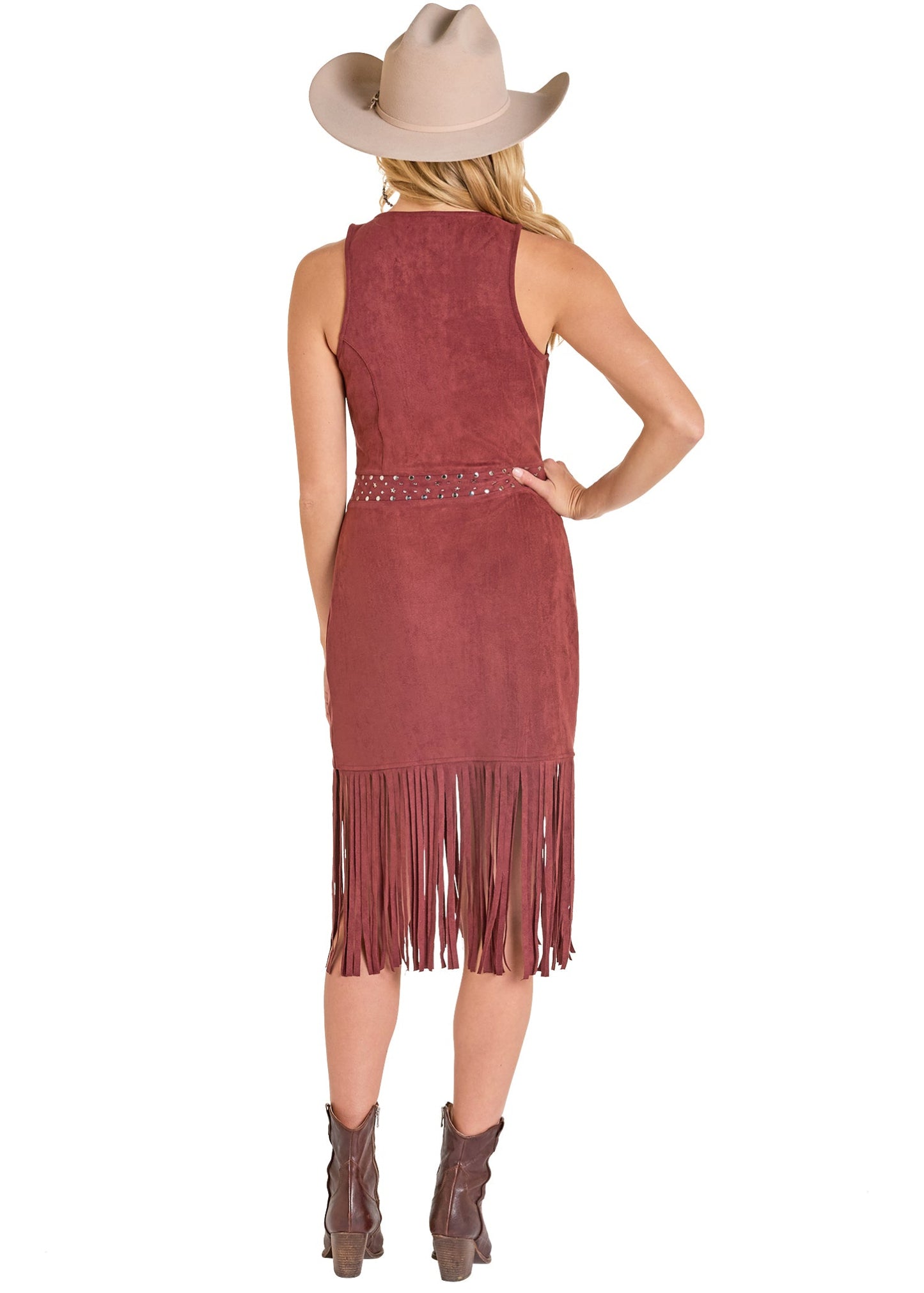 Woman wearing a maroon suede dress with fringe and a beige cowboy hat on a white background