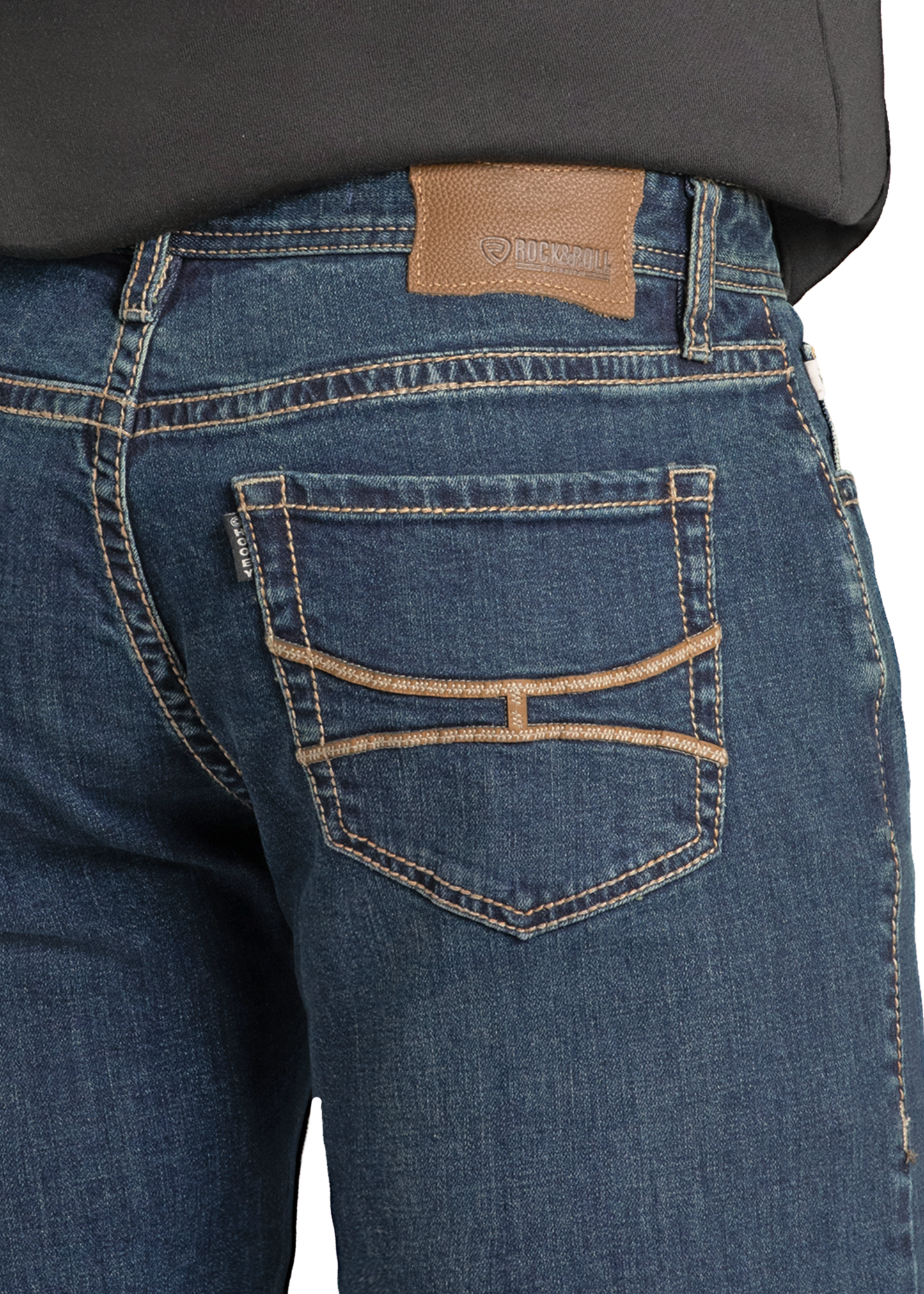 Close-up of the back pocket of Hooey Slim Fit Leather Embroidered Straight Leg Jeans by Rock & Roll Denim, featuring tan stitching and a brown leather patch at the waistband. The flexible jeans are paired with a tucked-in dark shirt.