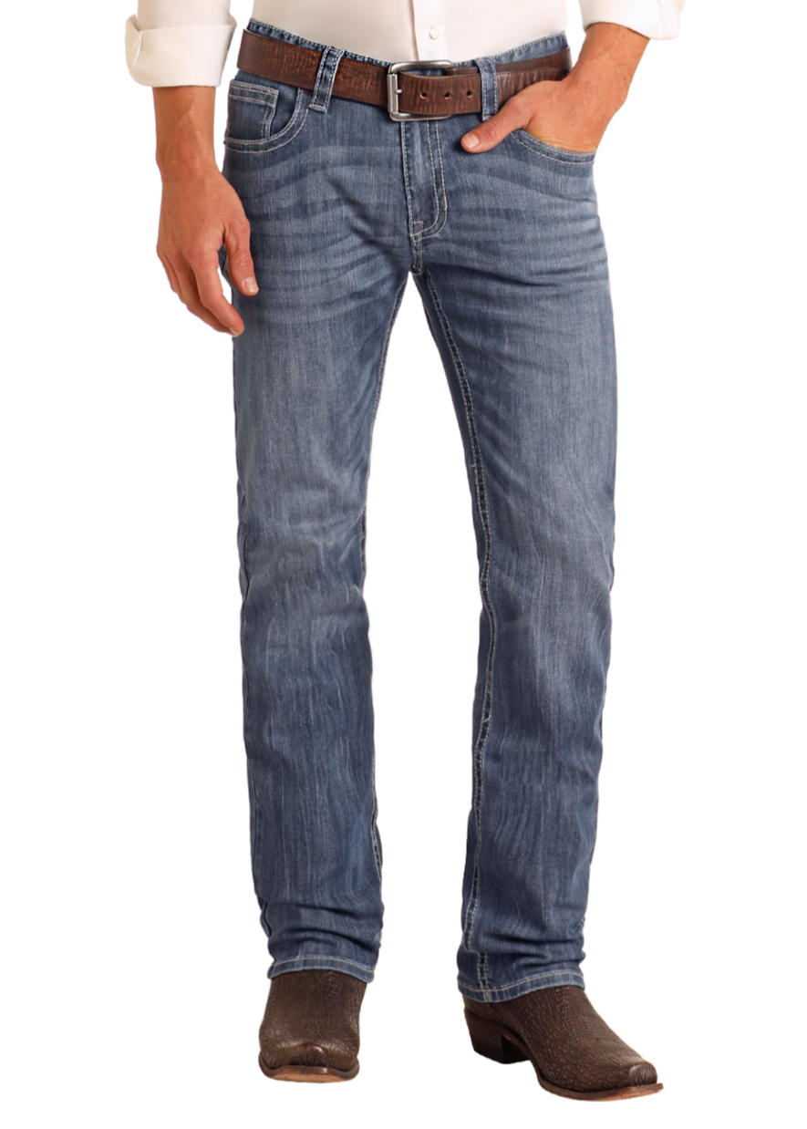 A person wearing Rock & Roll Denim Slim Fit Straight Leg Jeans, a brown belt, white shirt, and brown cowboy boots stands with hands in front pockets against a plain white background.