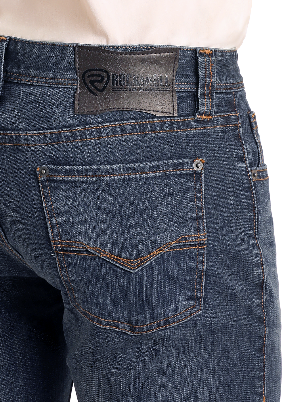 Close-up of a person wearing Slim Fit Dark Wash Straight Leg Jeans by Rock & Roll Denim. The focus is on the back, highlighting two rear pockets, orange stitching, and a black leather brand patch. White shirt is tucked in.