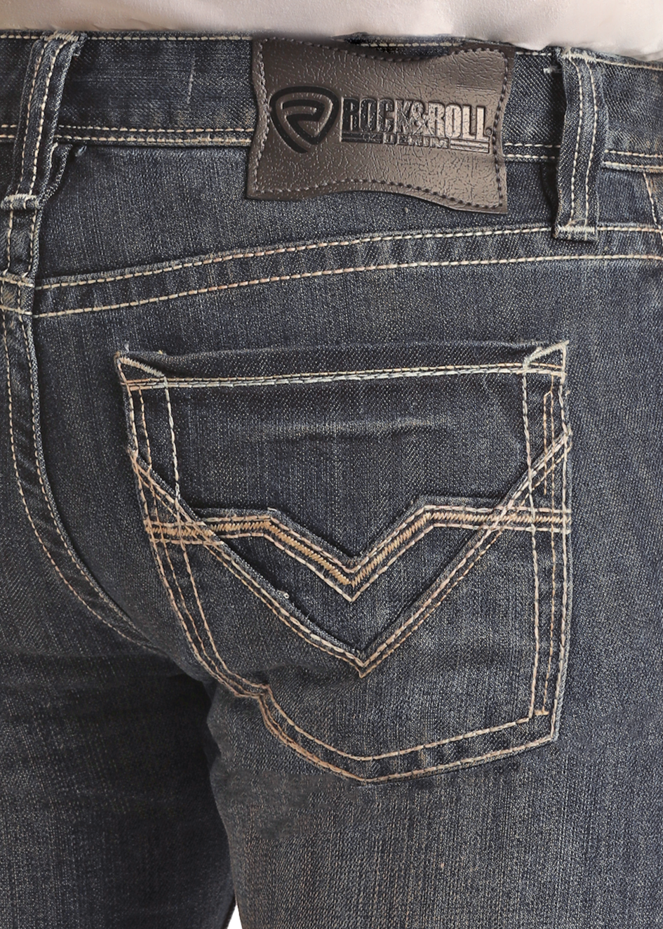 A person wearing Rock & Roll Denim Regular Fit Stackable Boot Jeans in dark blue, featuring durable fabric, decorative back pocket stitching, and a branded leather patch on the waistband. The image shows the back view.