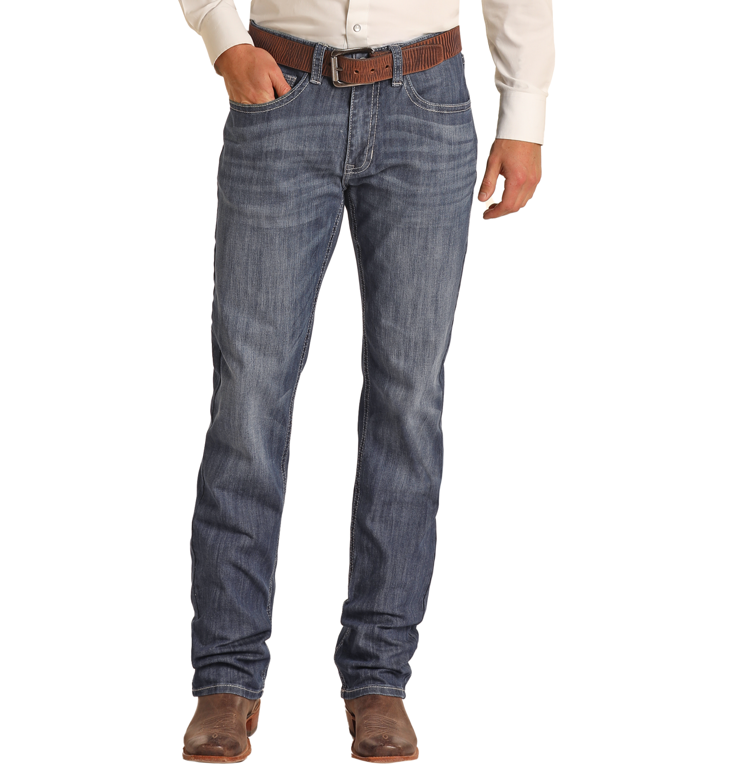 A person wearing a white shirt, brown belt, and brown cowboy boots stands with one hand in their pocket, showcasing Rock & Roll Denim's Relaxed Fit Dark Wash Stackable Bootcut Jeans against a plain background.