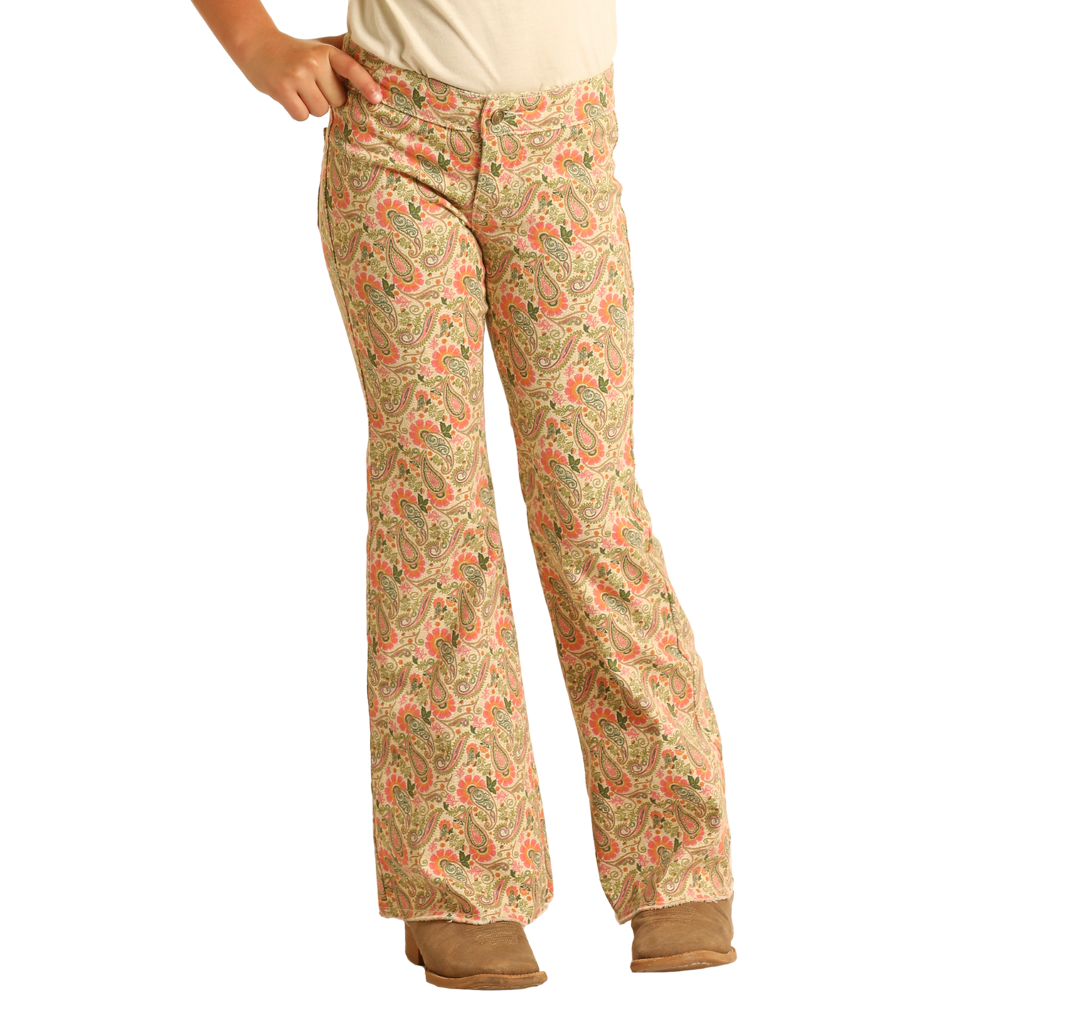 A person wears Rock & Roll Denim Girls' Paisley Print Flare Jeans, brown shoes, and a cream top, standing with one hand on their hip against a plain white background.