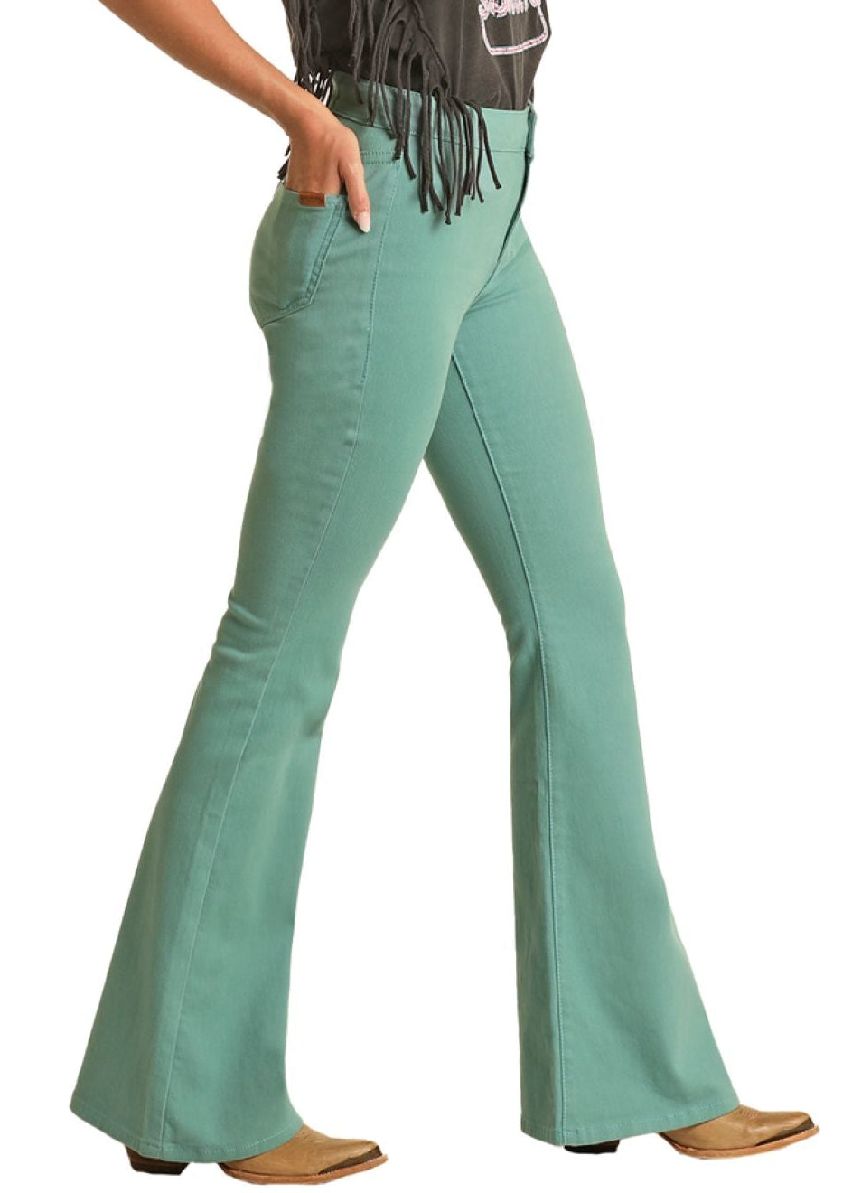 Woman wearing a black fringe top, teal bell-bottom pants, and a beige cowboy hat on a white background