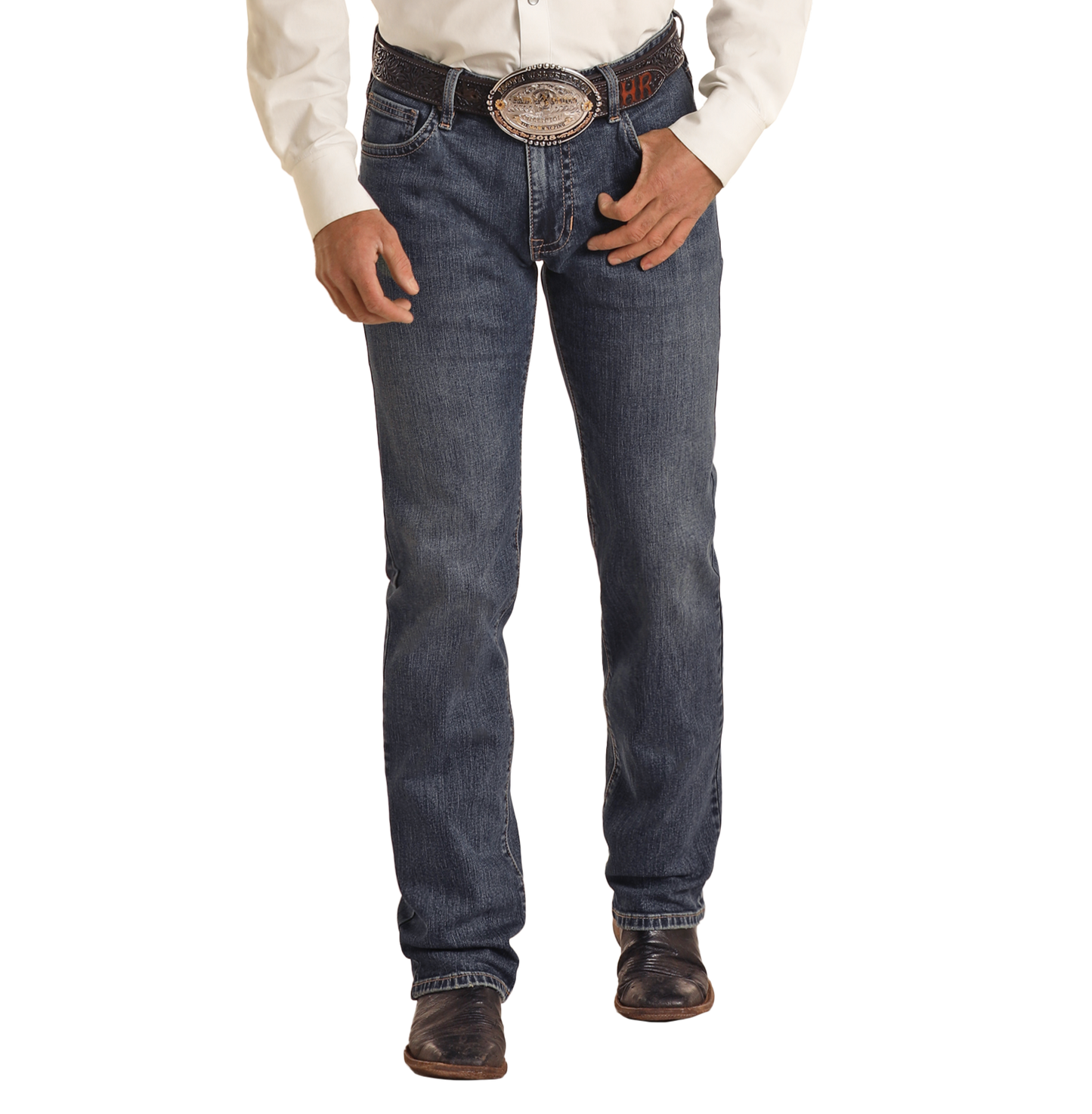 A person wearing Rock & Roll Denim Vintage '46 Slim Straight Leg Jeans with two-tone pocket stitching, a white shirt, an oval belt buckle, and brown boots stands against a plain background, shown from the waist down.