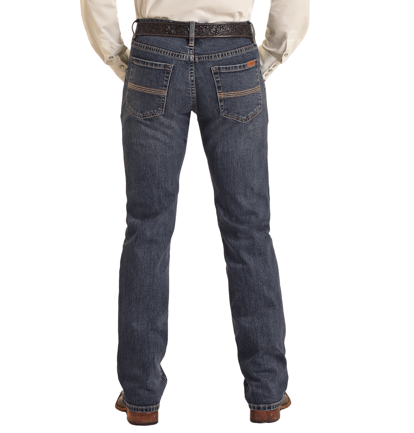 A person is shown from the back, standing against a plain white background, wearing Rock & Roll Denim Vintage '46 Slim Straight Leg Jeans with two-tone pocket stitch, a white shirt, black belt, and brown shoes.