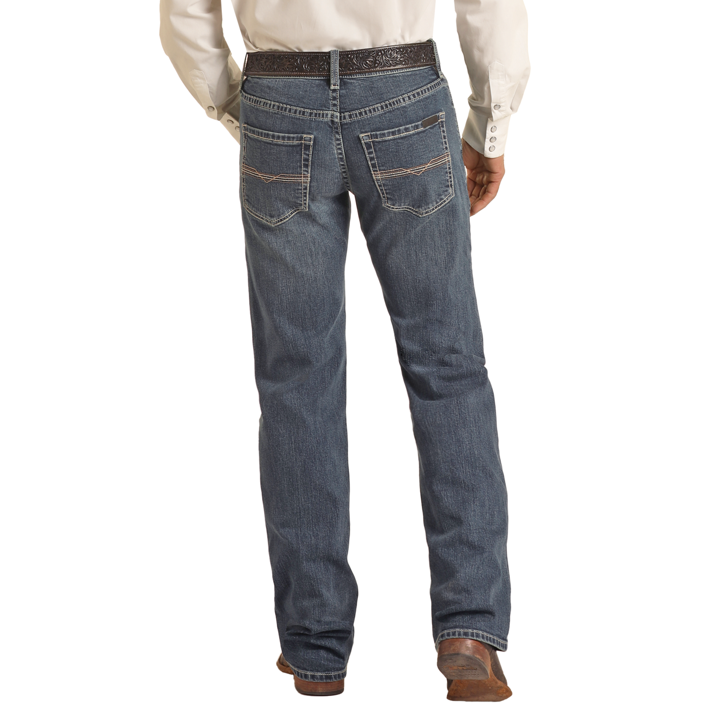 A person wearing a white shirt, black belt, brown cowboy boots, and Rock & Roll Denim Vintage '46 Regular Fit Stackable Bootcut Jeans with decorative back pocket stitching, shown from the back.