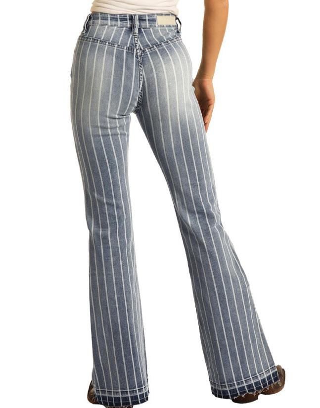 A person wears Rock & Roll Denim's High Rise Extra Stretch Striped Trousers, featuring vertical white stripes and flared legs. The blue jeans offer a flattering fit, shown from the back against a crisp white background.