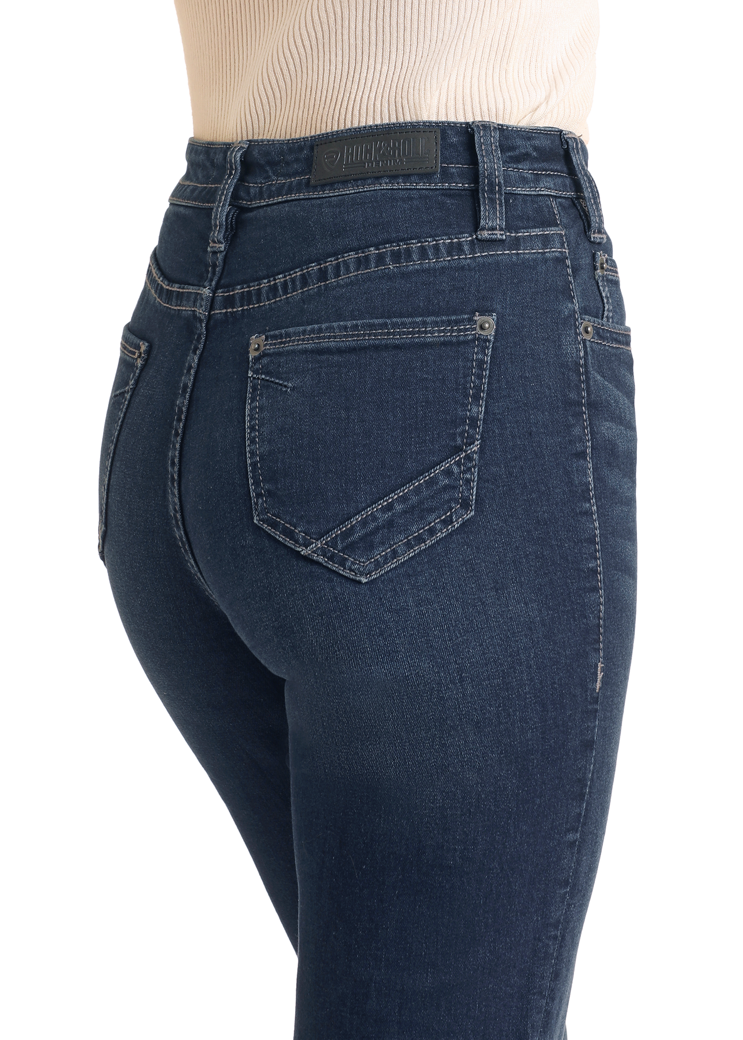 A person wearing Rock & Roll Denim Button Fly High Rise Trousers, shown from the side and back waist down, highlights the slim fit, button fly closure, and stitching details of these dark blue jeans.