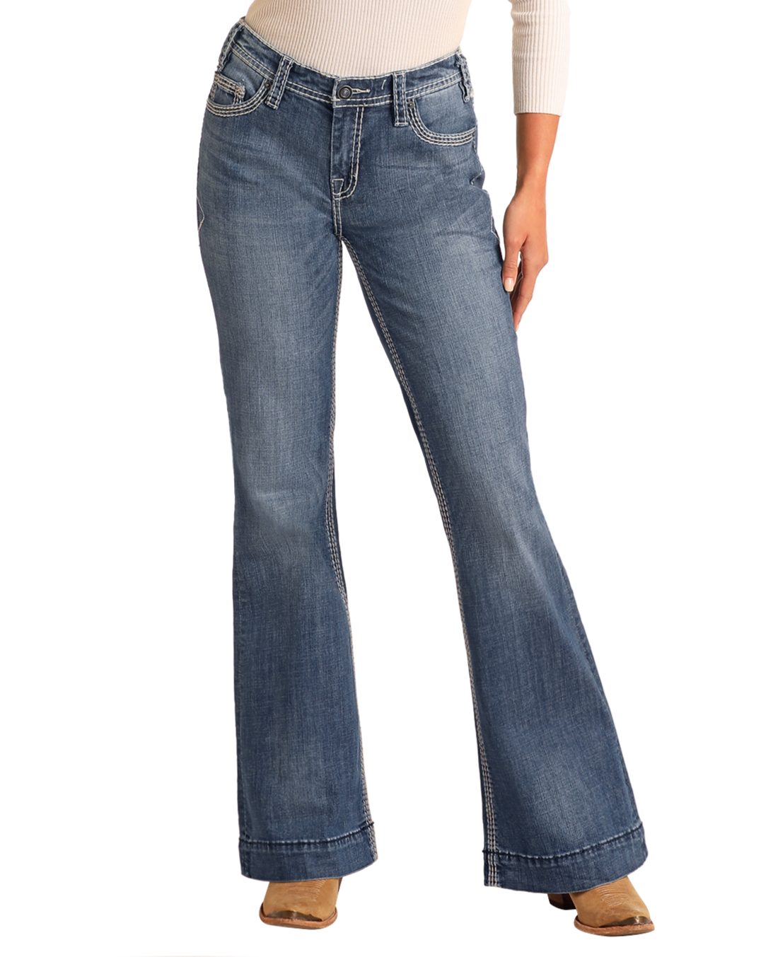 A person models the Rock & Roll Denim Mid Rise Petal Stitch Trousers with tan heeled boots, standing against a plain white background. Only their lower half is visible, with hands resting at their sides.