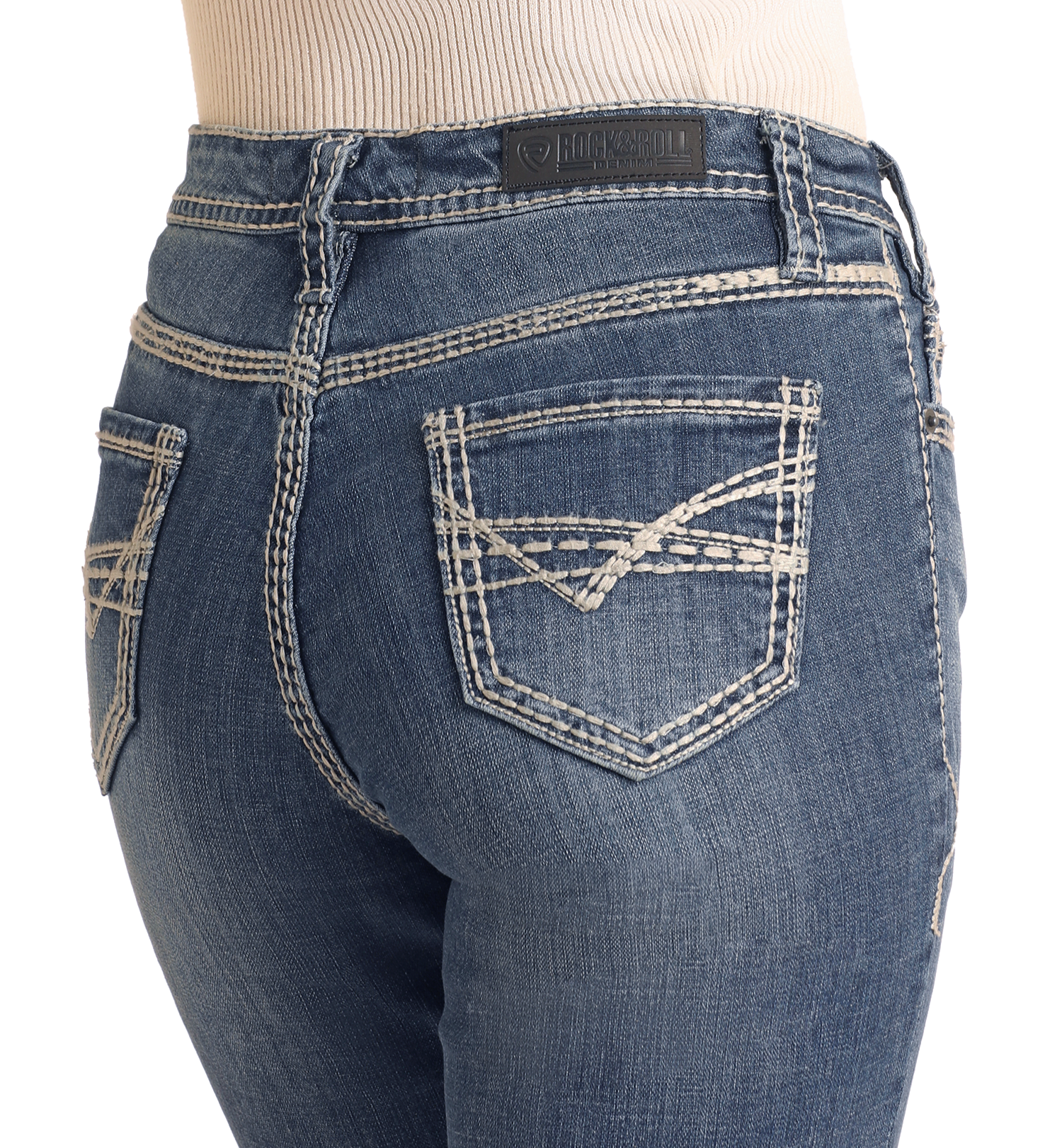 Close-up of a person wearing Rock & Roll Denim's Mid Rise Petal Stitch Trousers, featuring white double-stitching on the back pockets and waistband, a black leather brand patch, and a light ribbed top tucked in.